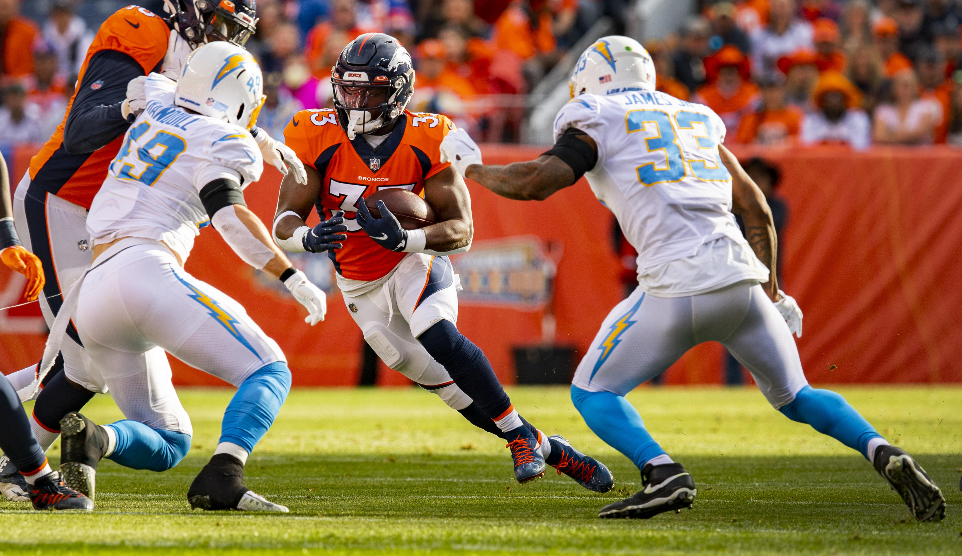 Denver Broncos running back Javonte Williams (33) runs down field agains the Los Angeles Chargers during the first Half Sunday, Nov. 28, 2021, at Empower Field at Mile High in Denver. (The Gazette, Christian Murdock) (Christian Murdock/The Gazette)