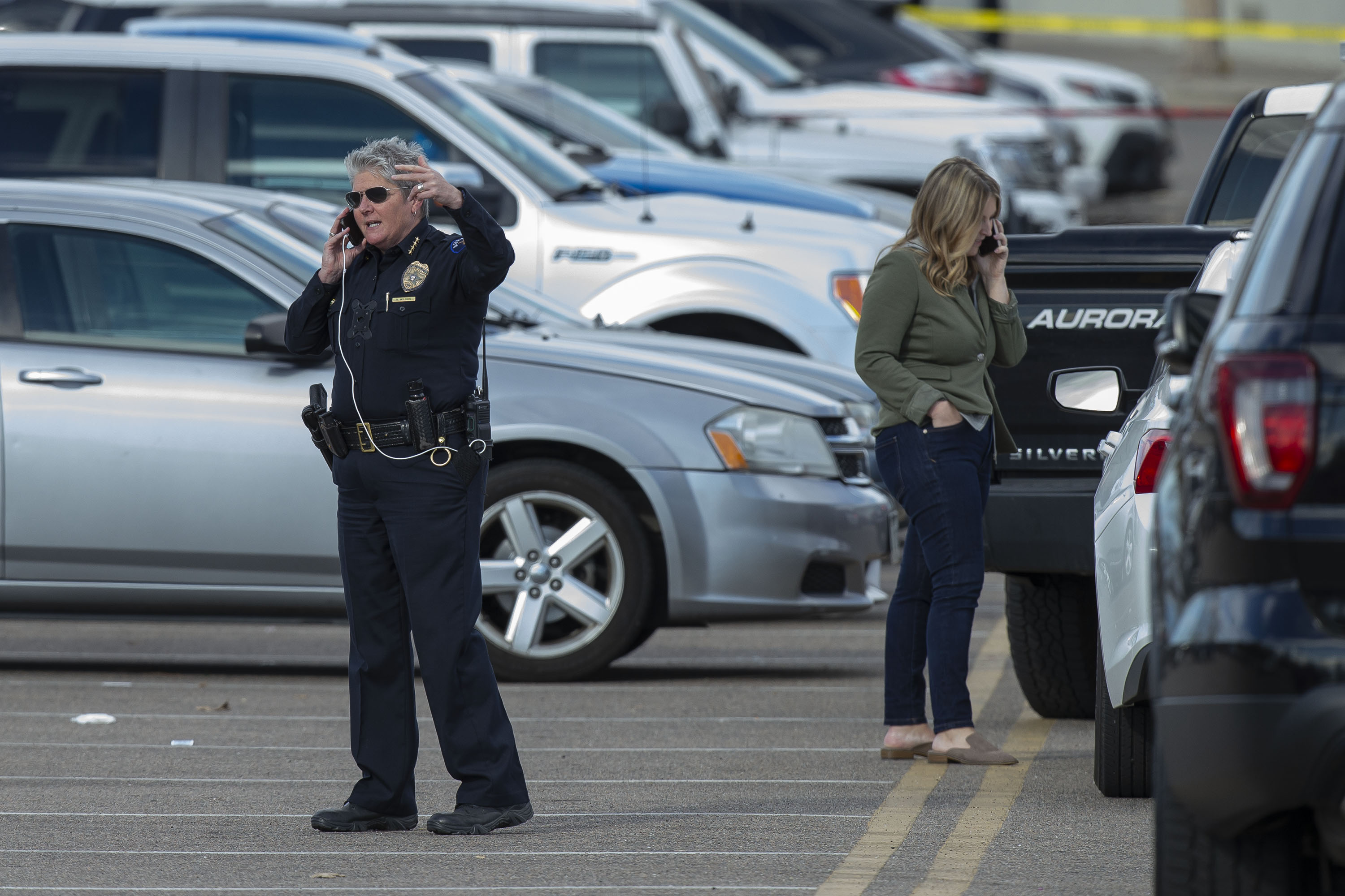Aurora Police chief Vanessa Wilson talks on the phone near the scene of a shooting at Hinkley High School that left three injured on Friday, Nov. 19, 2021, in Aurora, Colo. (Timothy Hurst/The Gazette) (Timothy Hurst)