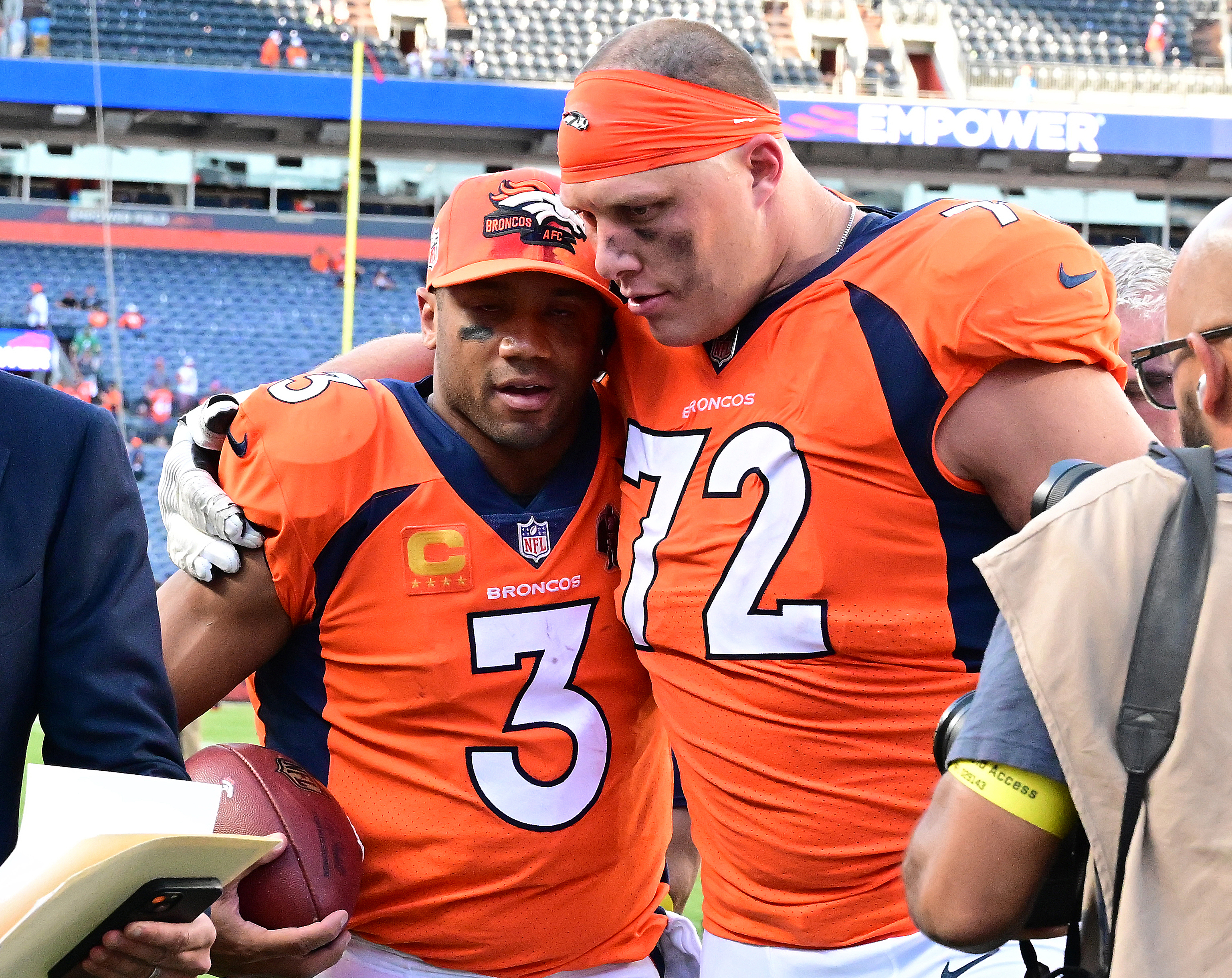 Denver Broncos quarterback Russell Wilson (3) and Denver Broncos offensive tackle Garett Bolles (72) walk off the field arm in arm after pulling out a win against the Houston Texans at Empower Field at Mile High Stadium on Sunday, Sept. 18, 2022. The Broncos defeated the Texans 16-9. (Photo by Jerilee Bennett, The Gazette) (Jerilee Bennett)