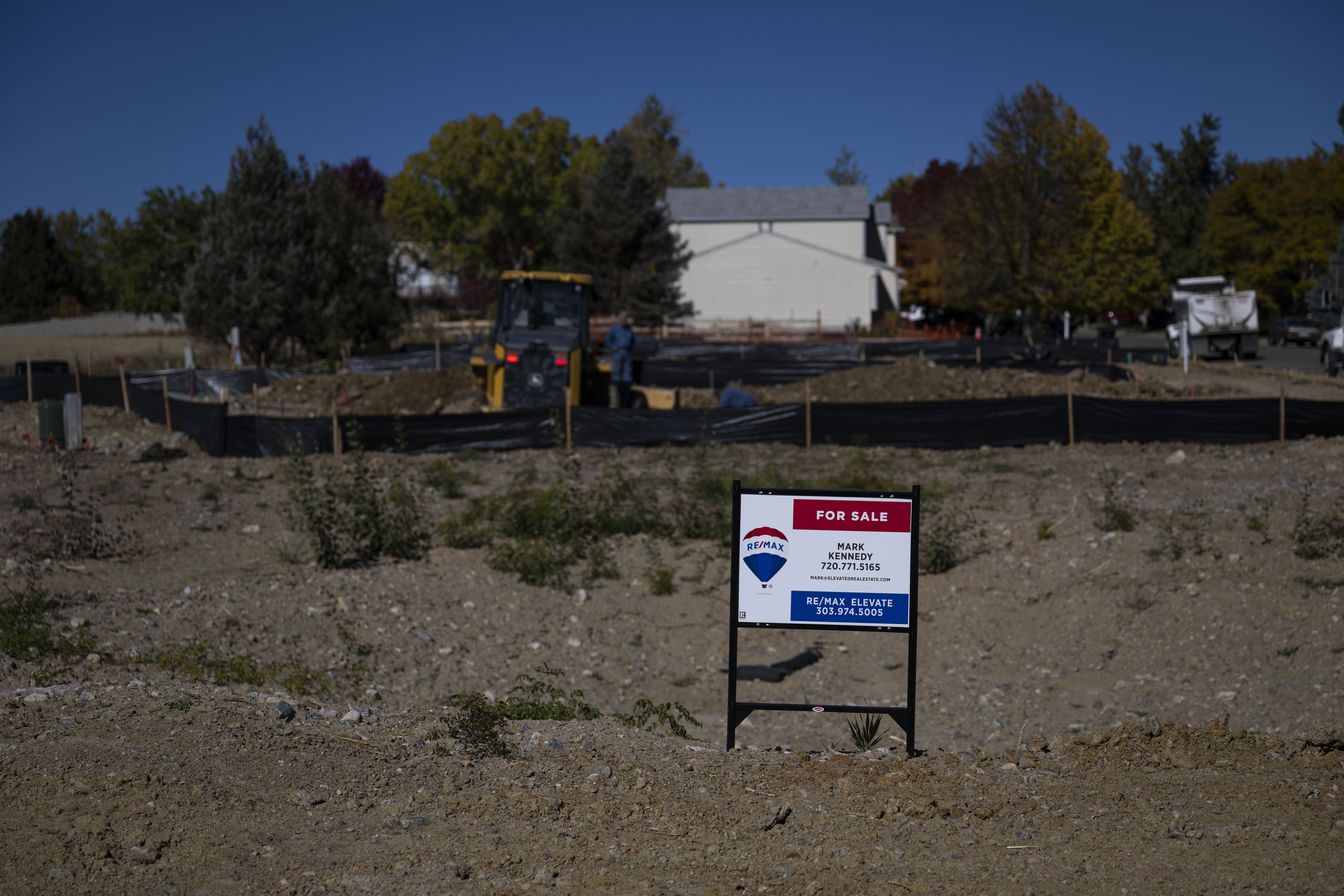 A “For Sale” sign is posted on the property adjacent to the Cheek family’s property as a bulldozer excavates the area to begin rebuilding their home lost in the 2021 Marshall Fire on Wednesday, Oct. 19, 2022, in Superior, Colo. (Timothy Hurst/The Gazette) (TimHursttim.hurst@gazette.comhttps://secure.gravatar.com/avatar/aca82bd62b4ee425c598527cd6faa1b1?d=mm&r=g)