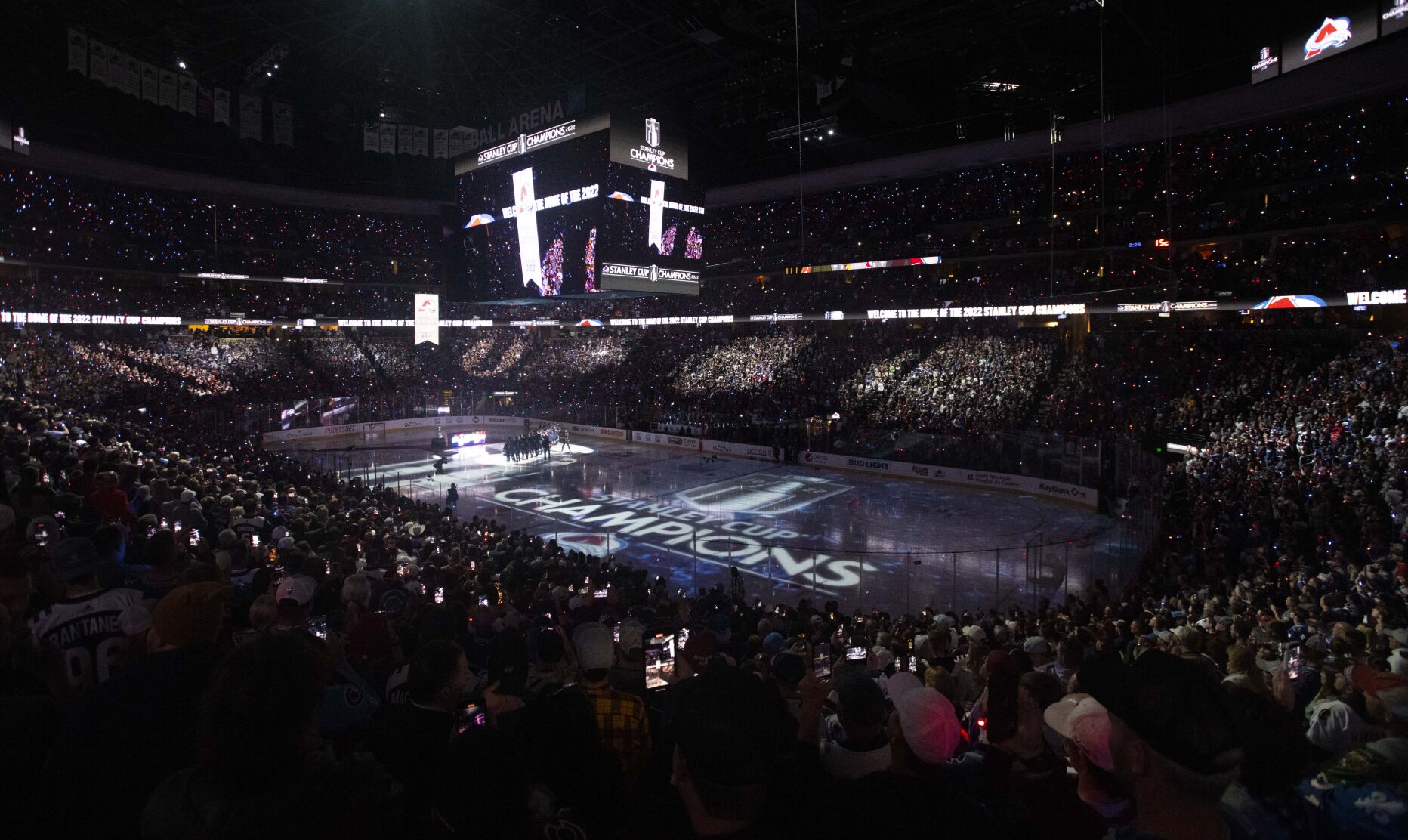 The Colorado Avalanche team watches as their 2022 Stanley Cup Champions banner is raised to the rafters before their season opener against the Chicago Blackhawks Wednesday, Oct. 12, 2022, at Ball Arena in Denver. (The Gazette, Christian Murdock) (Christian Murdock/The Gazette)