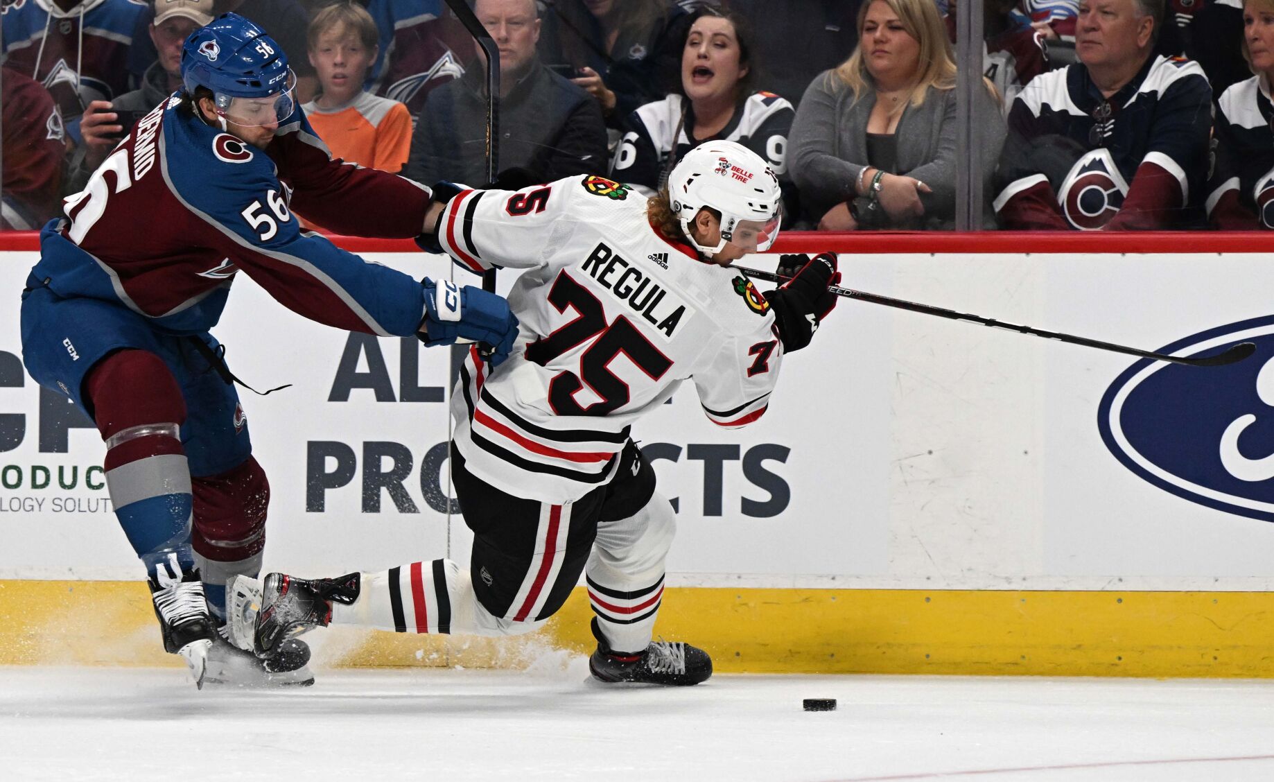 Colorado Avalanche defenseman Kurtis MacDermid (56) battles Chicago Blackhawks defenseman Alec Regula (75) for the puck during the first period Wednesday, Oct. 12, 2022, at Ball Arena in Denver. (The Gazette, Christian Murdock) (Christian Murdock/The Gazette)