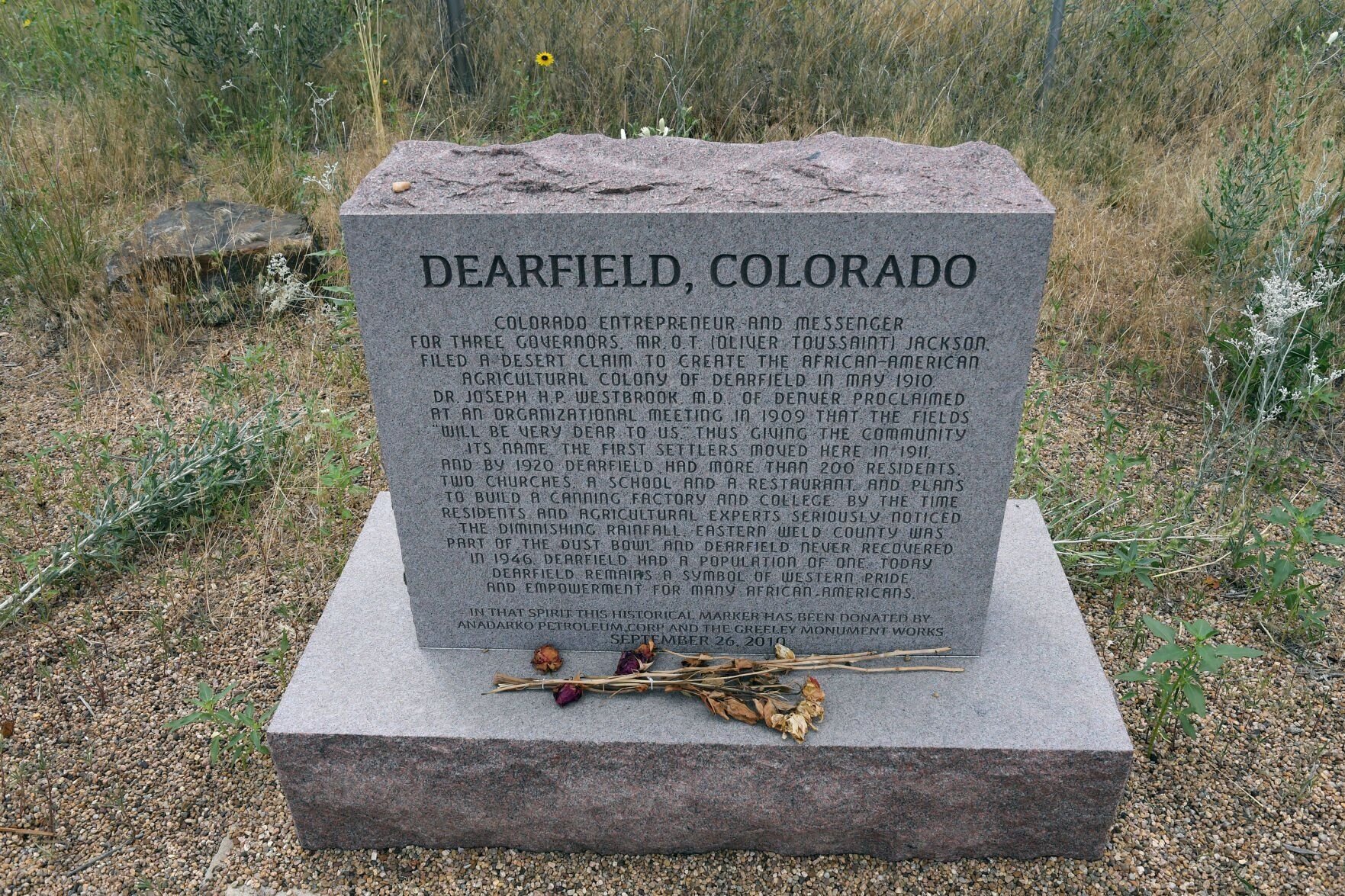 WELD COUNTY, CO - JULY 21: A stone marker sits at the entrance to the Dearfield townsite. Members of the Colorado General Assembly join Weld County officials on an historic tour of the Dearfield townsite located about 24 miles miles east of Greeley on July 21, 2021 in Weld County, Colorado. The group learned about the Deerfield Dream Project that emphasizes, archeological, historical, and environmental studies as well as protection of historic buildings and preservation of the early 20th Century African American colony of Dearfield. (Photo By Kathryn Scott) (Kathryn Scott)