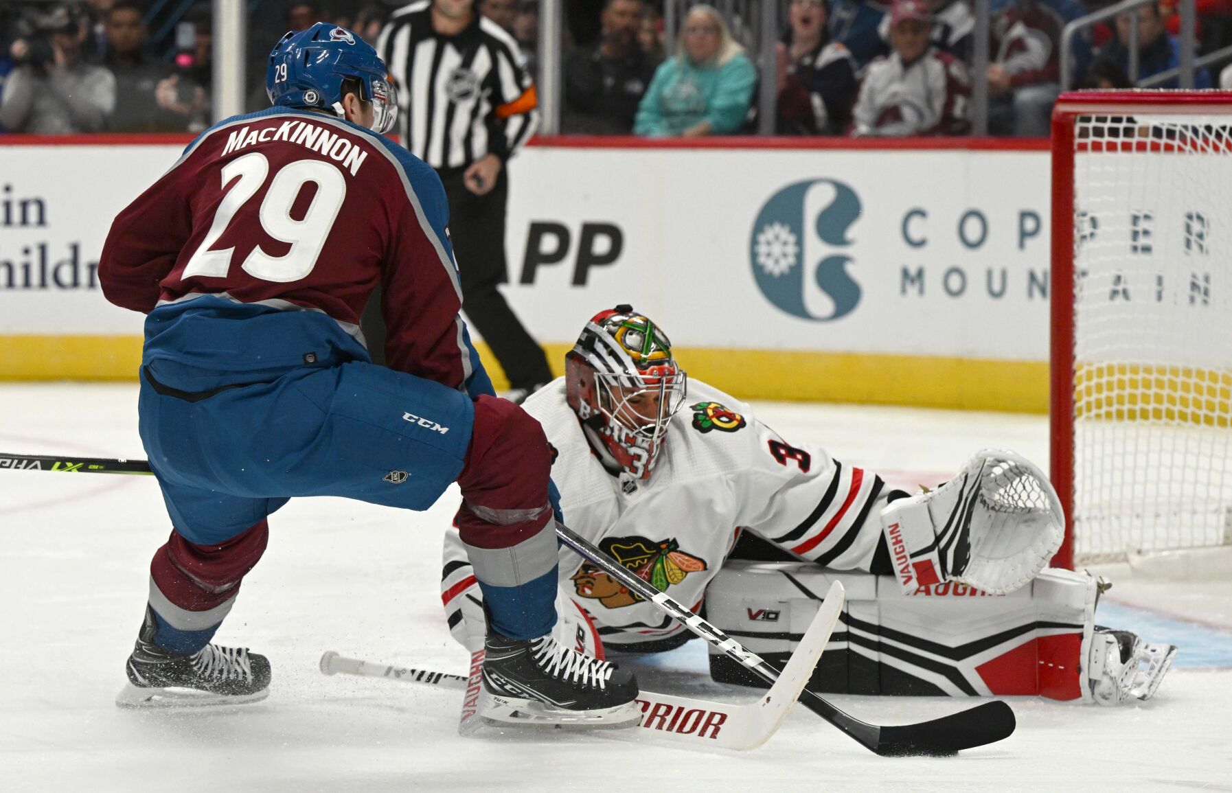 Chicago Blackhawks goaltender Petr Mrazek (34) stops a shot by Colorado Avalanche center Nathan MacKinnon (29) during the first period Wednesday, Oct. 12, 2022, at Ball Arena in Denver. (The Gazette, Christian Murdock) (Christian Murdock/The Gazette)