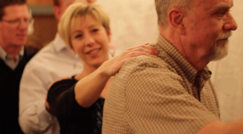 After the lights go out, attendees use the buddy system to make their way into the Blind Café experience. (Courtesy)