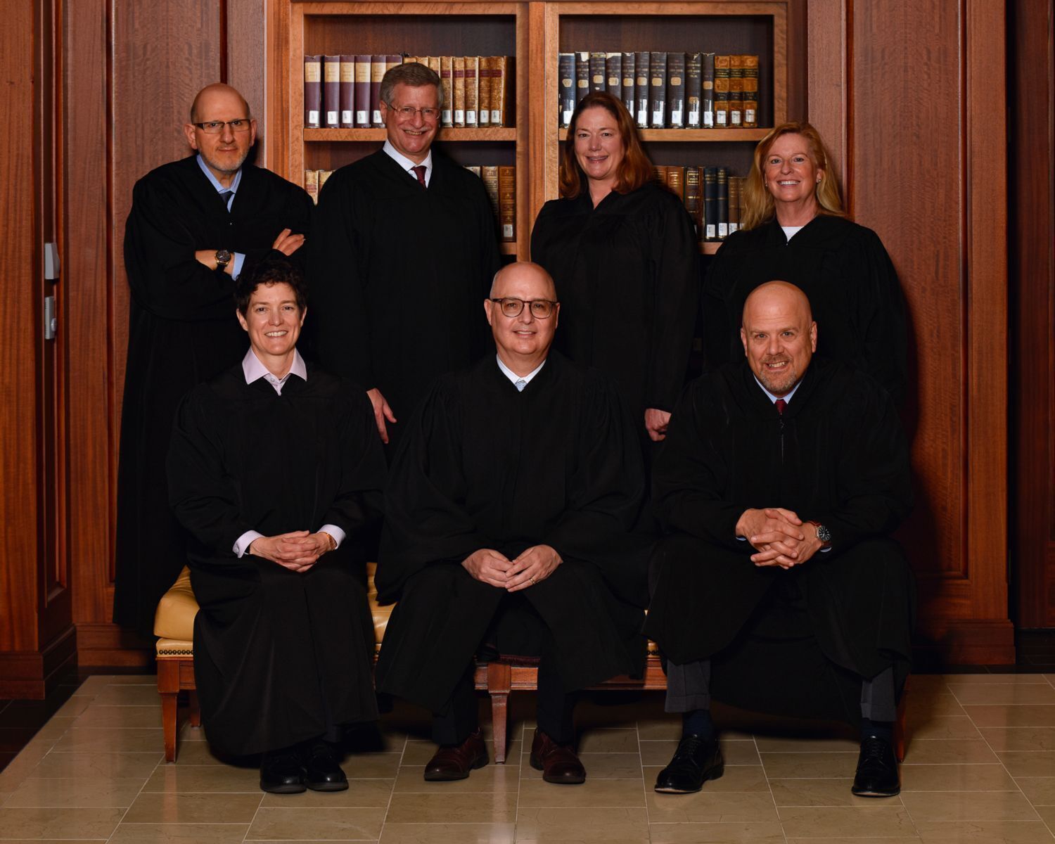 Colorado Supreme Court justices, back row from left: Carlos A. Samour Jr., Richard L. Gabriel, Melissa Hart and Maria E. Berkenkotter. Front row from left: Monica M. Marquez, Chief Justice Brian D. Boatright, and William W. Hood III. (Courtesy of Judicial Department)