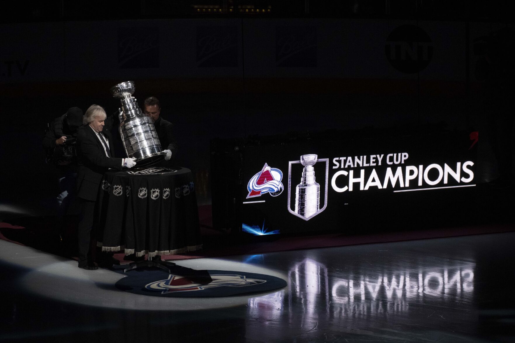 The Stanley Cup is moved to the ice as the 2022 Stanley Cup Champions celebration begins before the Colorado Avalanche's season opener against the Chicago Blackhawks Wednesday, Oct. 12, 2022, at Ball Arena in Denver. (The Gazette, Christian Murdock) (Christian Murdock/The Gazette)