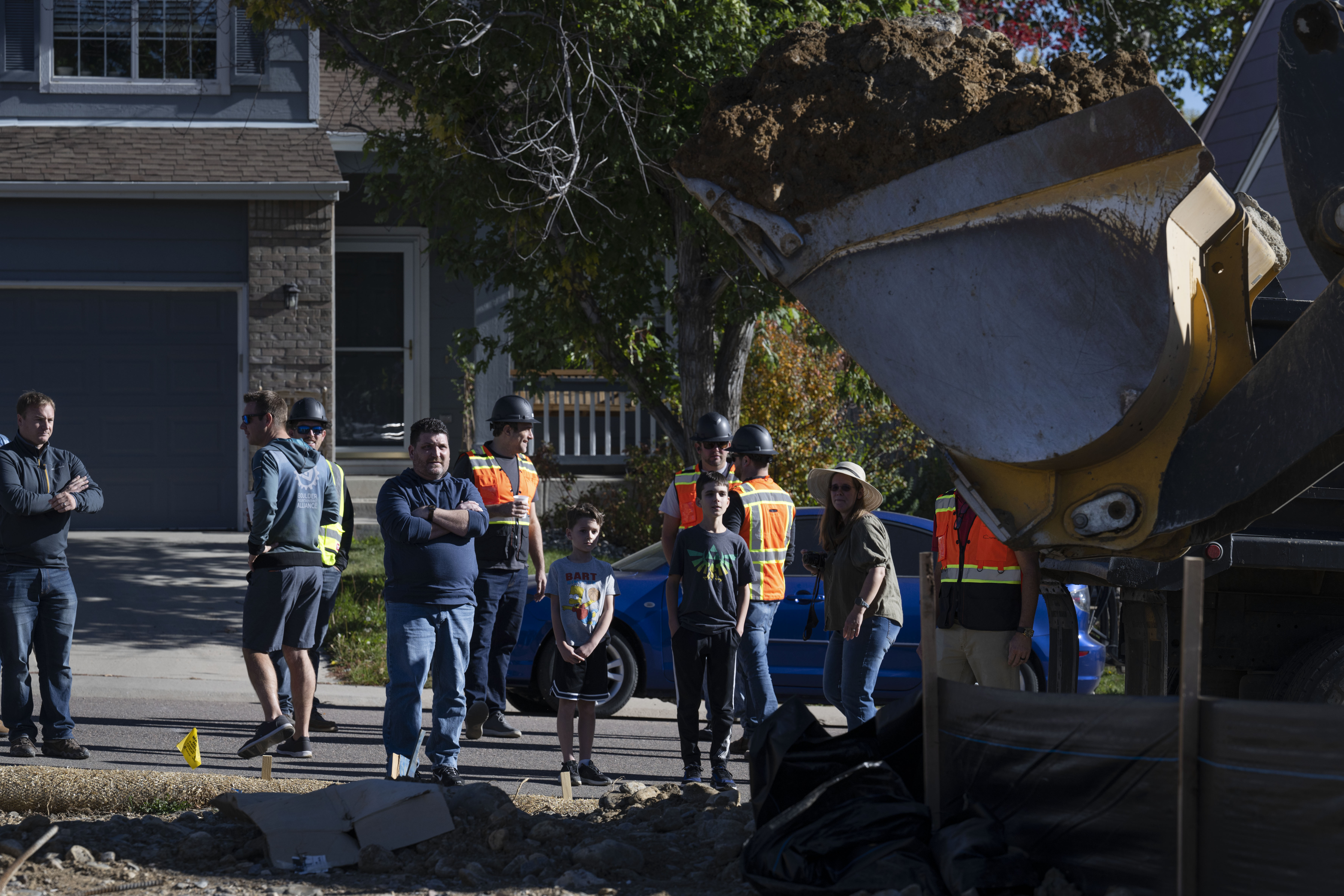 From front left, Chad, Collin, Nathan and Trisha Cheek watch as a bulldozer excavates their property to begin building their new home, replacing their home lost in the Marshall Fire of 2021, on Wednesday, Oct. 19, 2022, in Superior, Colo. (Timothy Hurst/The Gazette) (TimHursttim.hurst@gazette.comhttps://secure.gravatar.com/avatar/aca82bd62b4ee425c598527cd6faa1b1?d=mm&r=g)
