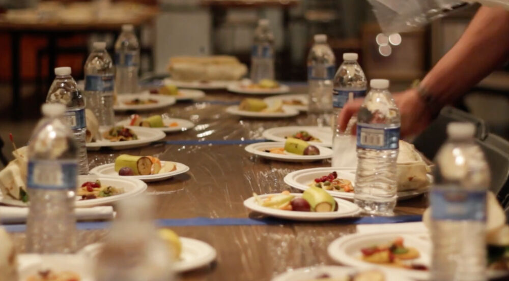 The food is laid out for Blind Café attendees before they are led to their places in a darkened room. (Courtesy)
