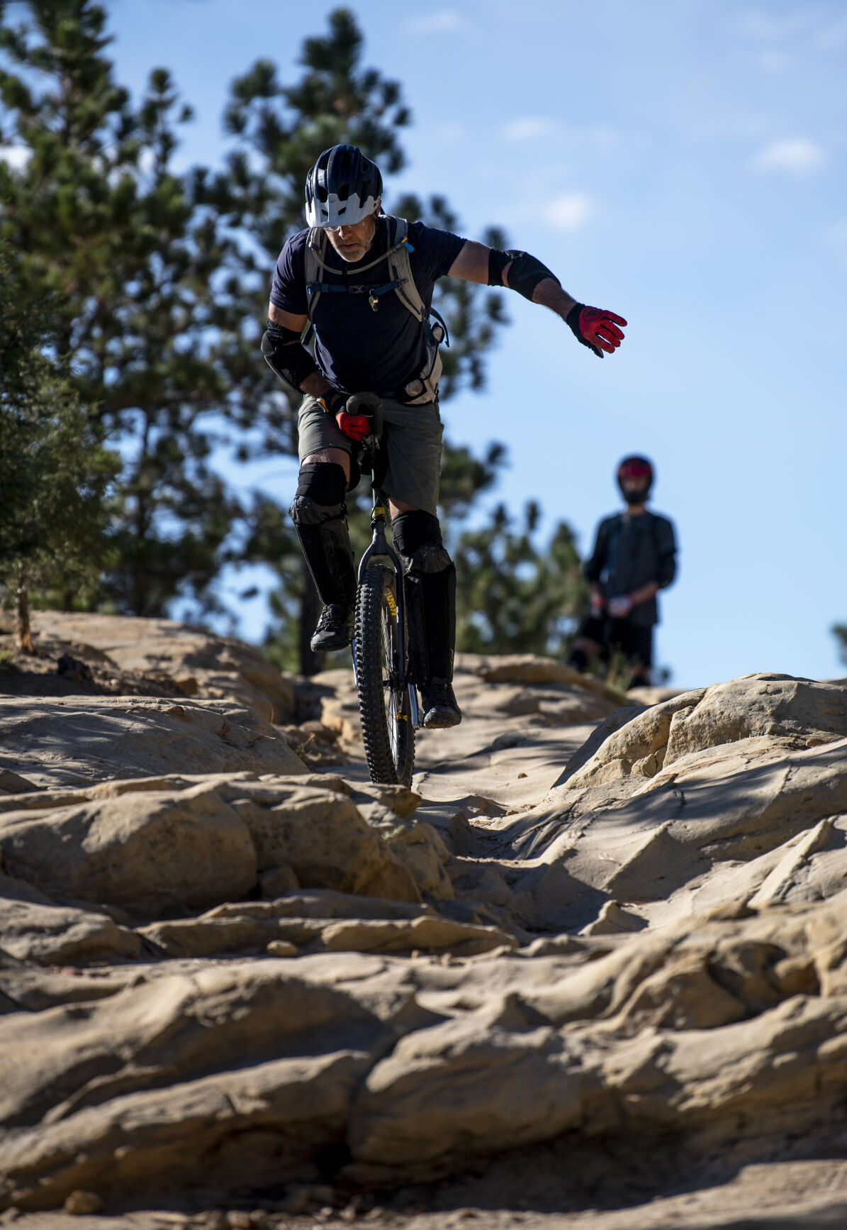 Rob Urban rides his mountain unicycle over rocky obstacles on Ute Valley Park Trail in Ute Valley Park last week. Urban is part of a small community of mountain unicycle riders. In Colorado Springs, Urban says he can count the fellow riders he knows on one hand. (Photos by Parker Seibold/, The Gazette)