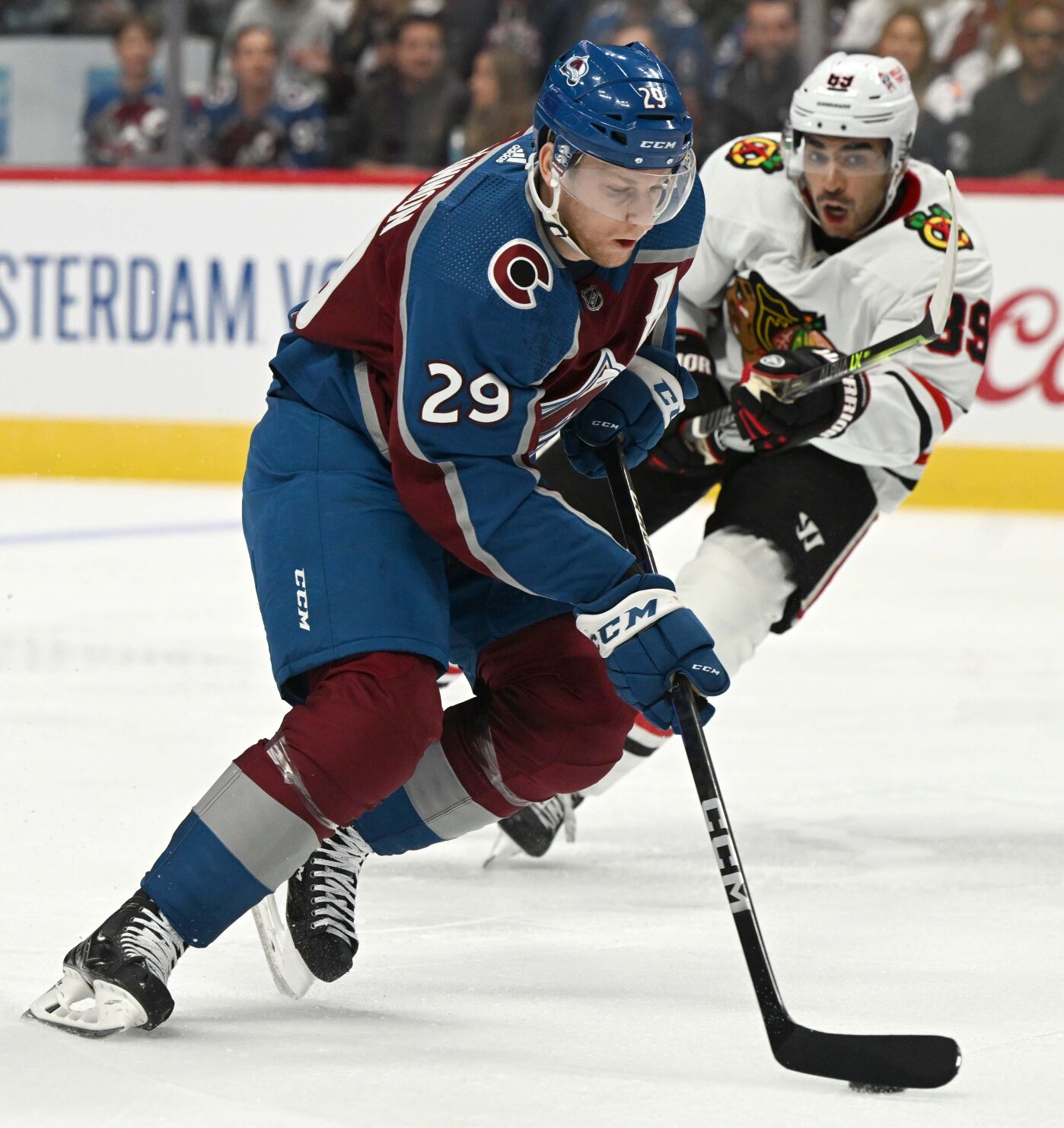 Colorado Avalanche center Nathan MacKinnon (29) skates past Chicago Blackhawks center Andreas Athanasiou (89) during the first period Wednesday, Oct. 12, 2022, at Ball Arena in Denver. (The Gazette, Christian Murdock) (Christian Murdock/The Gazette)