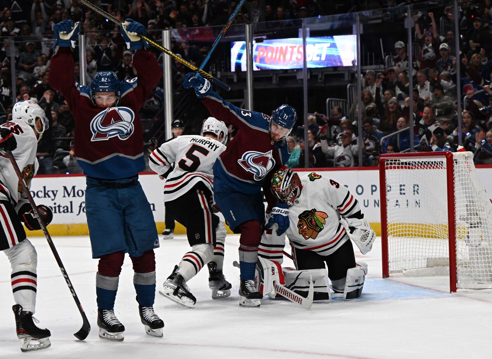 Colorado Avalanche left wing Artturi Lehkonen (62) and right wing Valeri Nichushkin (13) celebrate after Nichushkin scored against Chicago Blackhawks goaltender Petr Mrazek (34) during the first period Wednesday, Oct. 12, 2022, at Ball Arena in Denver. (The Gazette, Christian Murdock) (Christian Murdock/The Gazette)
