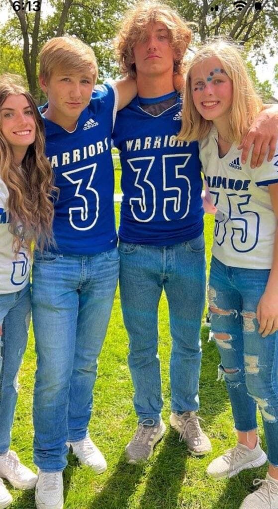 Young James (second from left and wearing the number 3) lives in a tiny town in Nebraska where he is a 14 year old freshman in high school and playing on the Junior Varsity football team. (Erica Rankin)