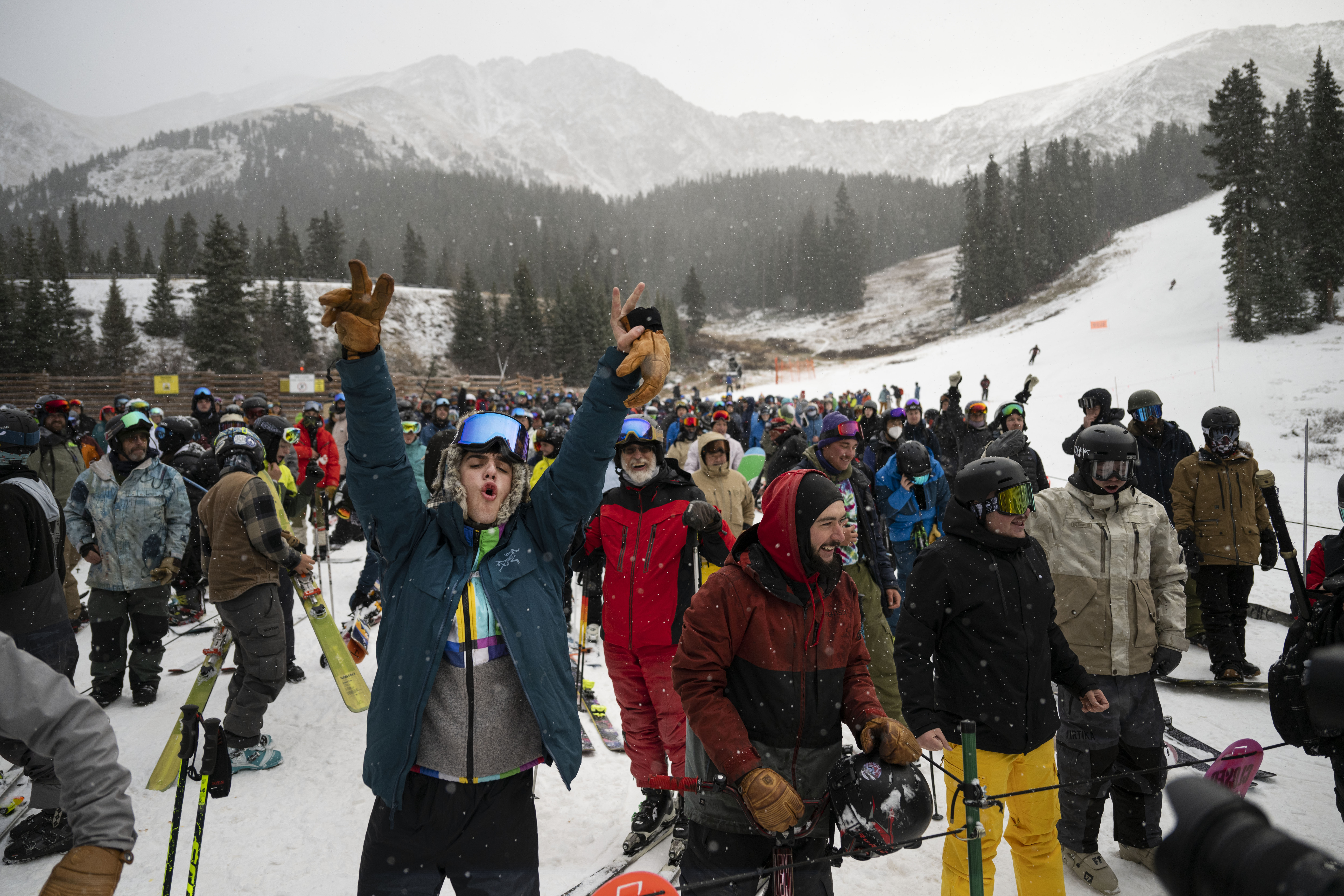 Mason Davis cheers with the crowd when it’s announced that marketing team members will be handing out rolls of duct tape to the first people waiting in line for the Black Mountain Express Lift to open during opening day at Arapahoe Basin Ski Area on Sunday, Oct. 23, 2022, near Dillon, Colo. (Timothy Hurst/The Gazette) (TimHursttim.hurst@gazette.comhttps://secure.gravatar.com/avatar/aca82bd62b4ee425c598527cd6faa1b1?d=mm&r=g)
