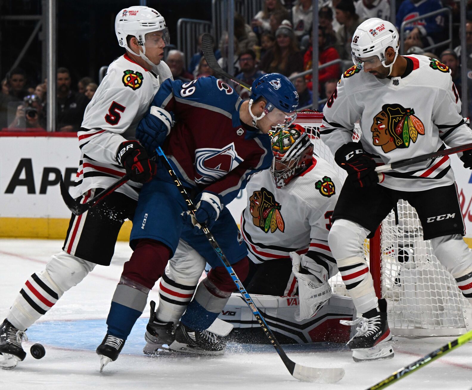 Colorado Avalanche left wing Ben Meyers (59) battles Chicago Blackhawks defenseman Connor Murphy (5) and Chicago Blackhawks left wing Jujhar Khaira (16) for the puck in front of the Blackhawks goal during the first period Wednesday, Oct. 12, 2022, at Ball Arena in Denver. (The Gazette, Christian Murdock) (Christian Murdock/The Gazette)