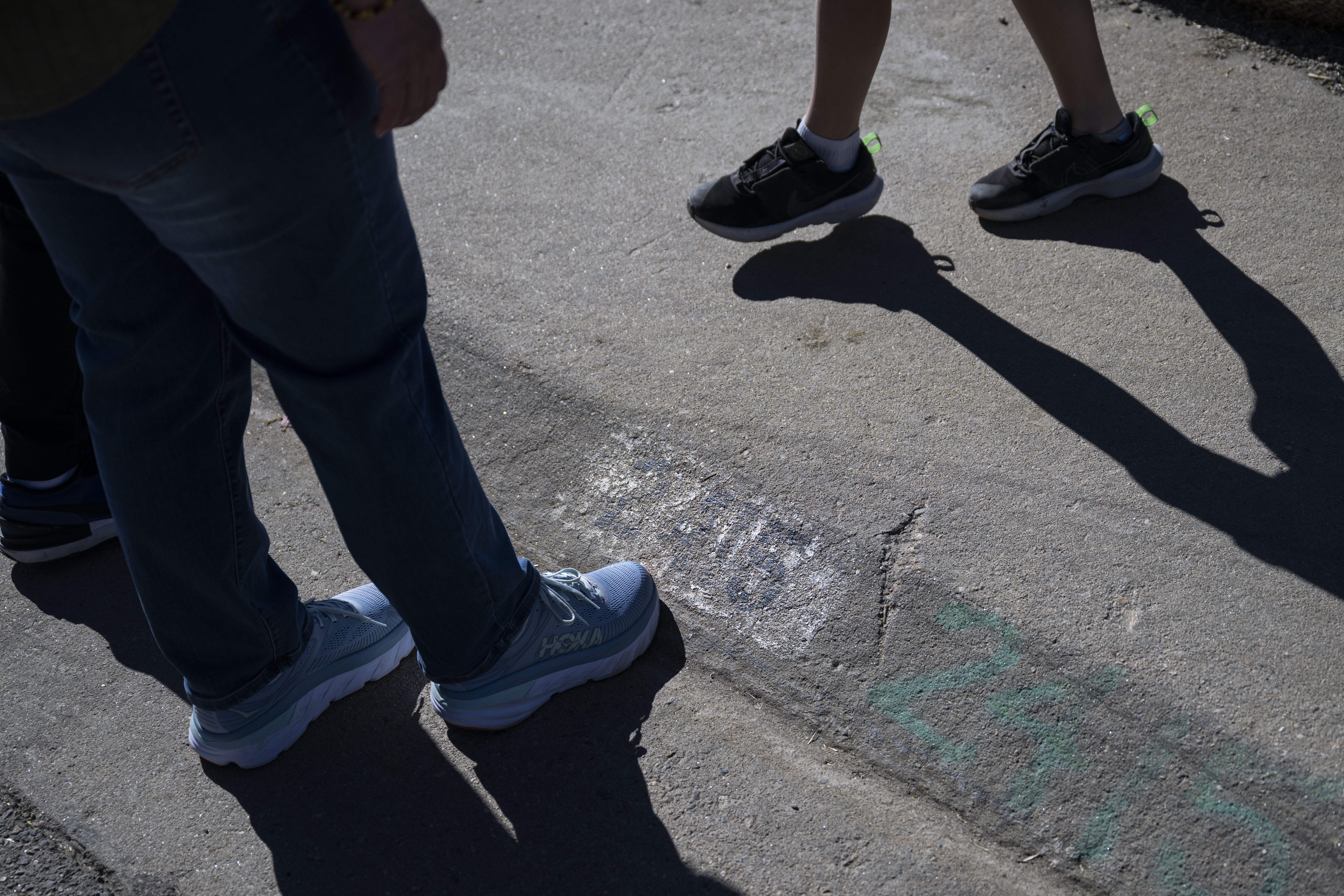 Trisha Cheek points out their faded house number on the curb to her sons Nathan, 14, and Collin, 8, during the groundbreaking for their home which was lost in the 2021 Marshall Fire, on Wednesday, Oct. 19, 2022, in Superior, Colo. (Timothy Hurst/The Gazette) (TimHursttim.hurst@gazette.comhttps://secure.gravatar.com/avatar/aca82bd62b4ee425c598527cd6faa1b1?d=mm&r=g)
