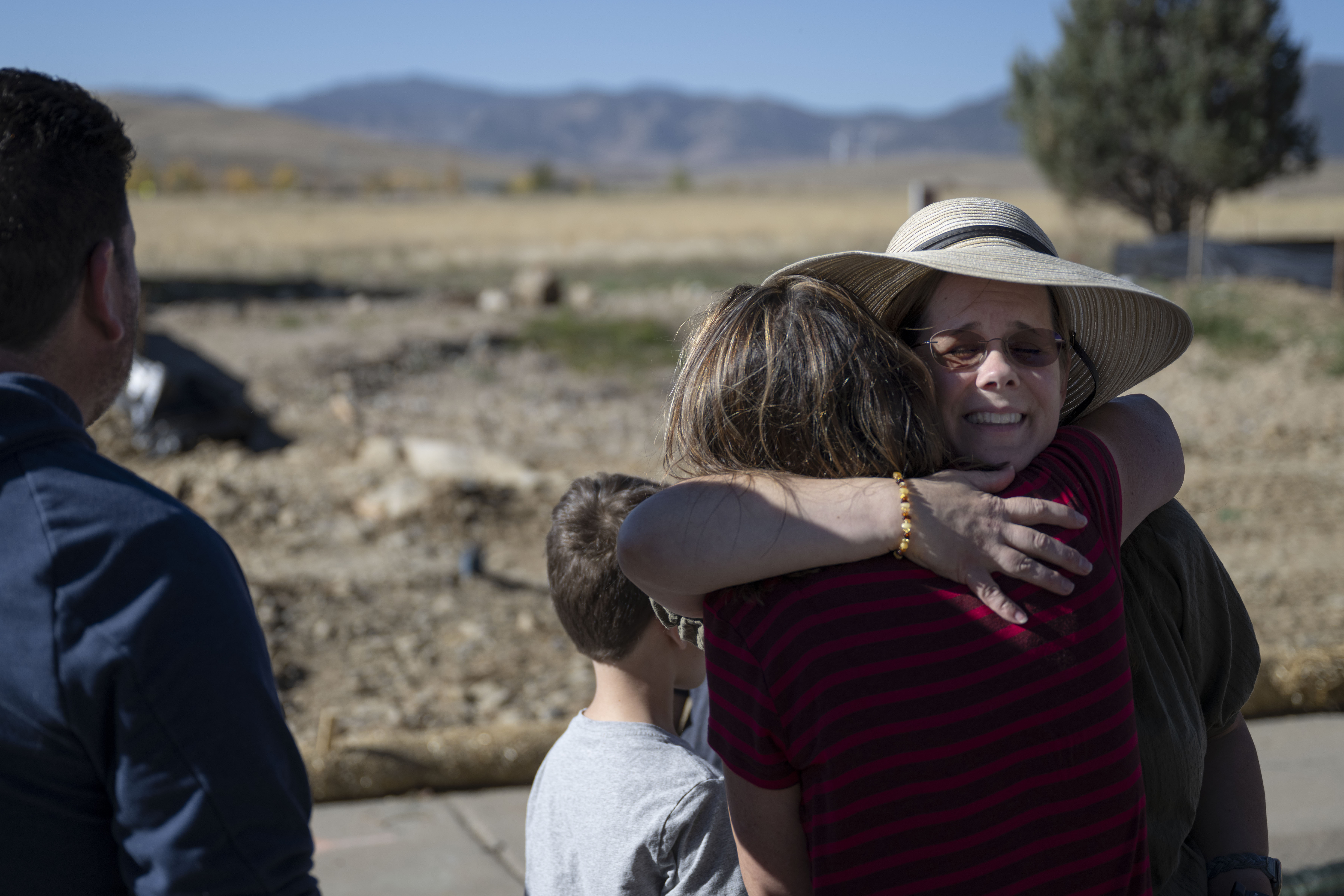 Neighbor Cheryl Ruff, left, hugs Trisha Cheek as Cheek and her family watch their property being excavated to begin rebuilding their home lost in the 2021 Marshall Fire, on Wednesday, Oct. 19, 2022, in Superior, Colo. (Timothy Hurst/The Gazette) (TimHursttim.hurst@gazette.comhttps://secure.gravatar.com/avatar/aca82bd62b4ee425c598527cd6faa1b1?d=mm&r=g)