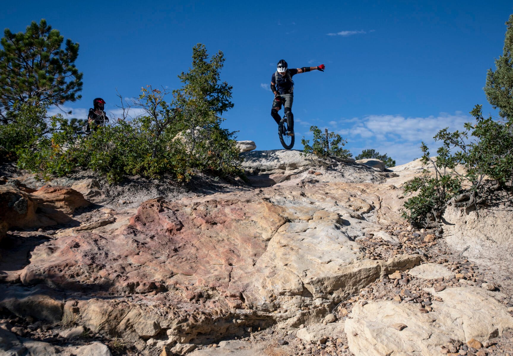 Rob Urban balances himself on his unicycle before riding down rocky terrain Wednesday at Ute Valley Park. (Parker Seibold, The denver Gazette)