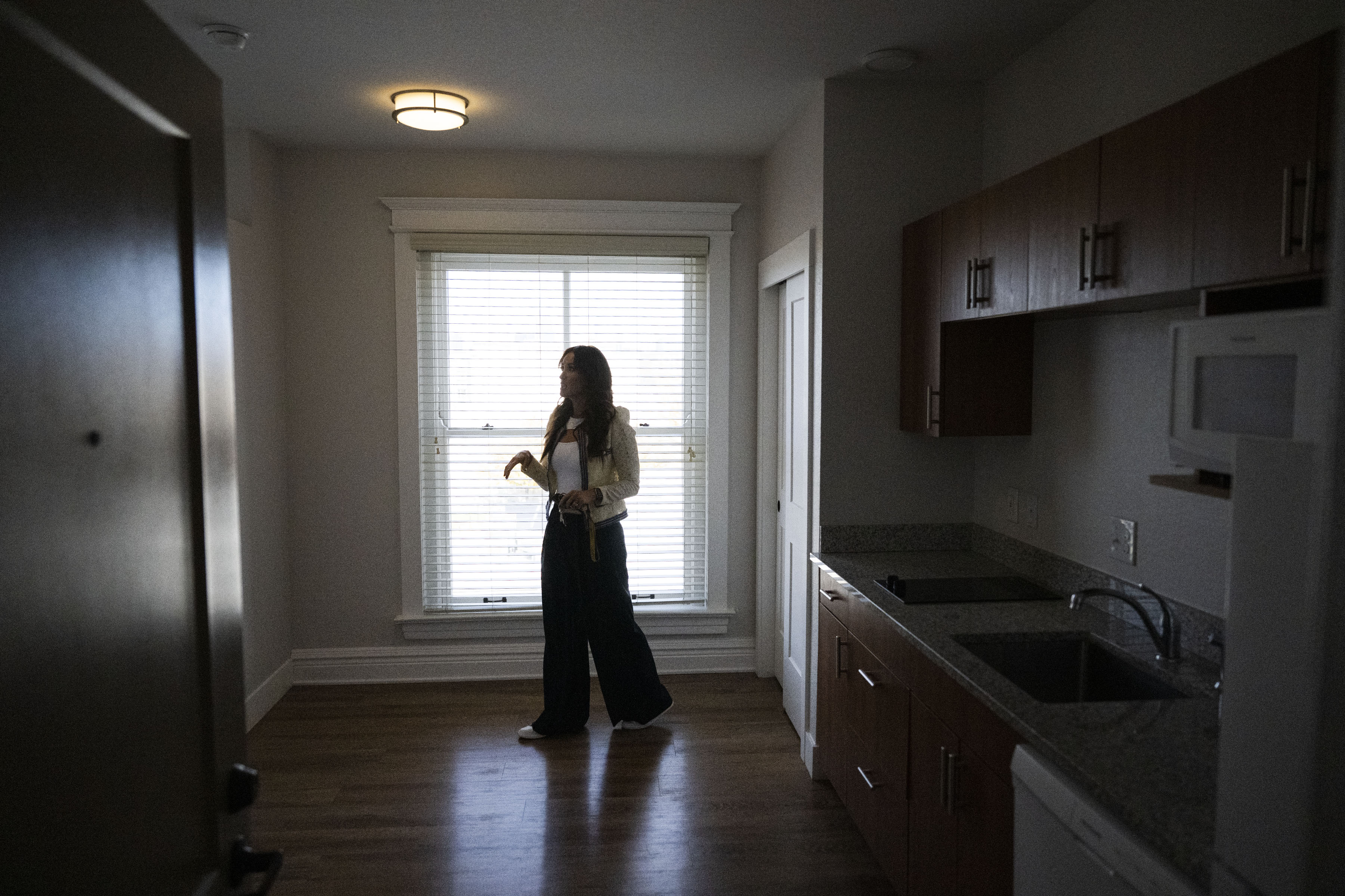 Zócalo Community Development Senior Director of Real Estate Lisa Jefferies shows unit 413 on Friday, Oct. 21, 2022, at The Quayle Building at North Broadway and West 1st Avenue of Denver, Colo. (Timothy Hurst/The Gazette) (TimHursttim.hurst@gazette.comhttps://secure.gravatar.com/avatar/aca82bd62b4ee425c598527cd6faa1b1?d=mm&r=g)