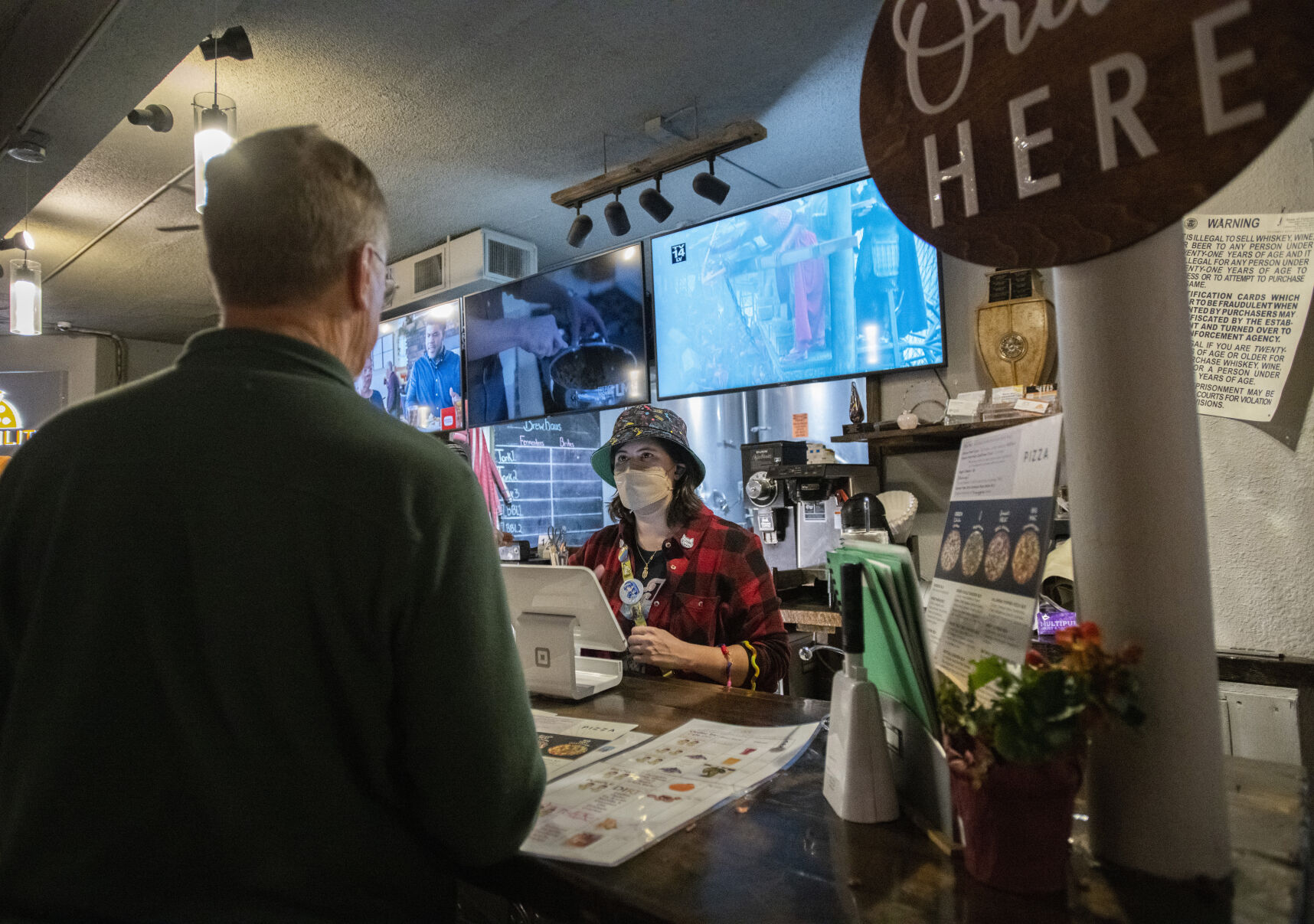 Bartender Madison Sherock takes an order from David Bishton Wednesday at Brewability. (Christian Murdock,The Gazette)