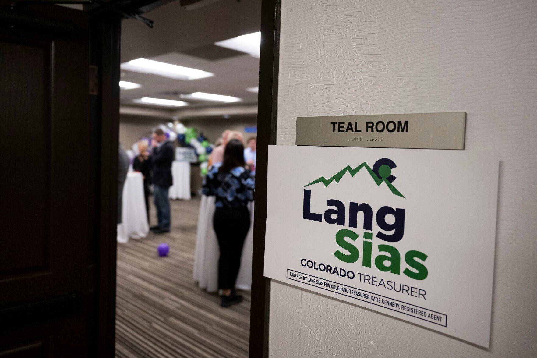 Party-goers hang out in a hotel room for Colorado State Treasurer candidate Lang Sias during the Colorado GOP Election Night Party on Tuesday, Nov. 8, 2022, at the DoubleTree by Hilton DTC in Greenwood Village, Colo. (Timothy Hurst/The Gazette) (TIMOTHY HURST/DENVER GAZETTE)