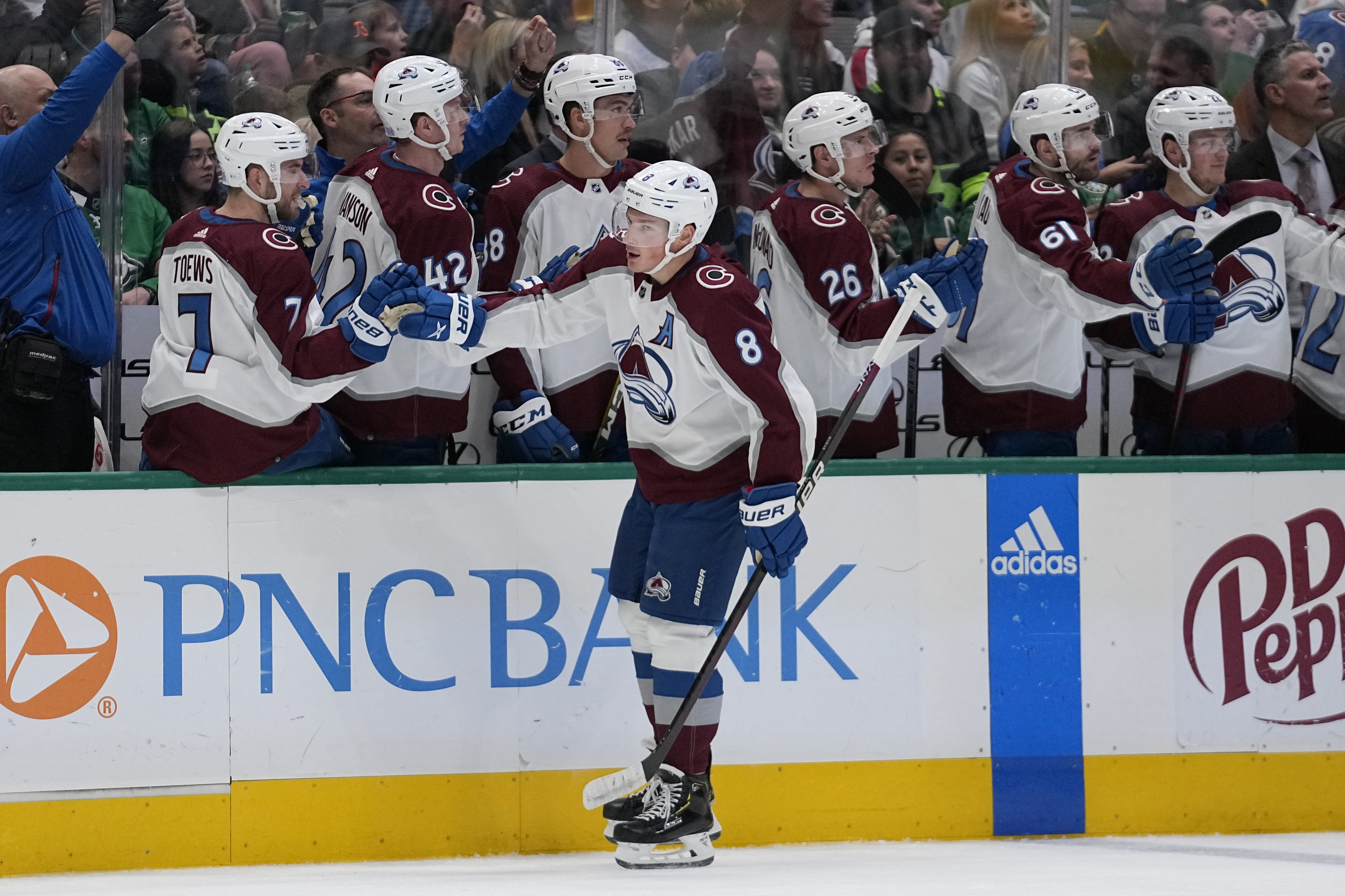 Colorado Avalanche defenseman Cale Makar (8) celebrates with the bench after scoring agaist the Dallas Stars in the first period of an NHL hockey game Monday, Nov. 21, 2022, in Dallas. (AP Photo/Tony Gutierrez) (Tony Gutierrez)