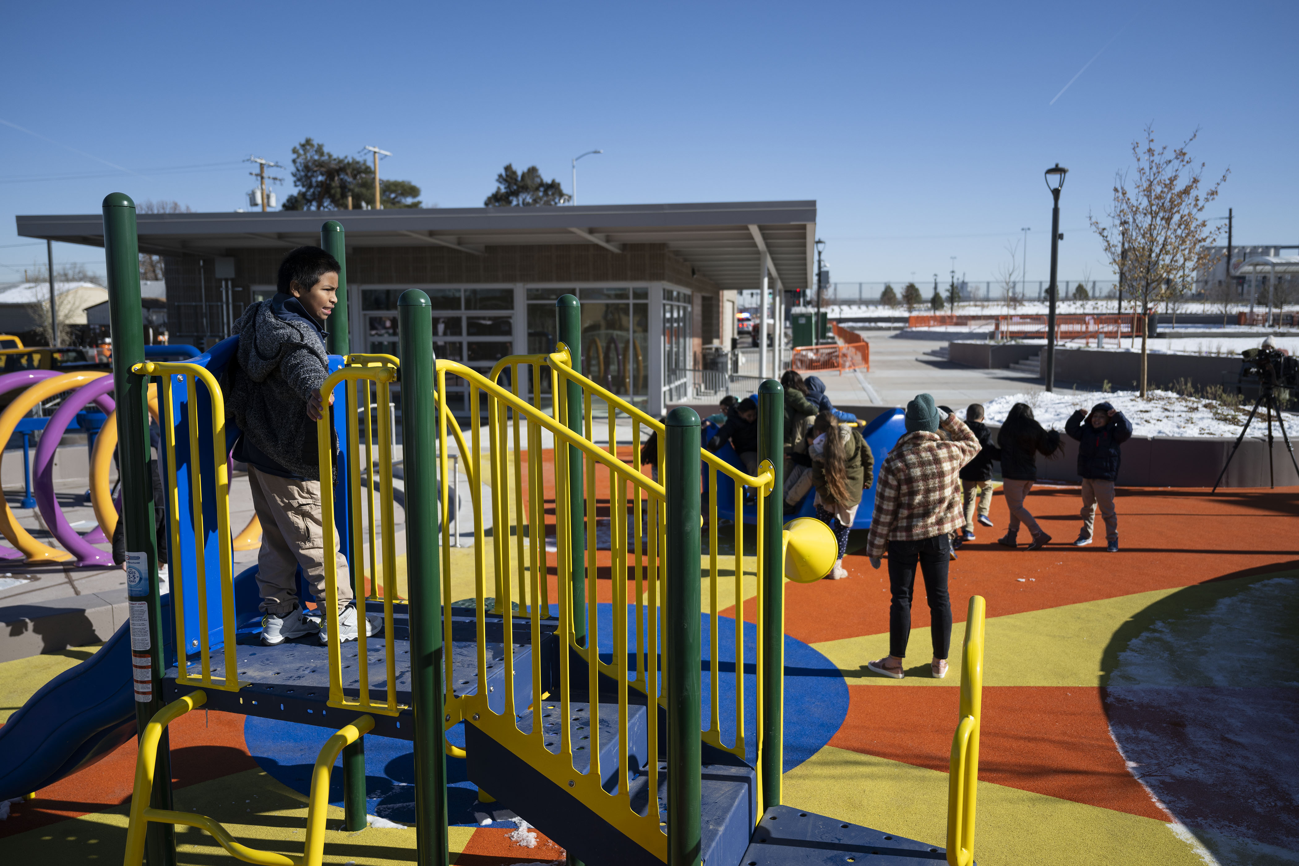 Swansea Elementary School third grader Eric, left, and the rest of his classmates try out some of the new playground equipment after a ribbon-cutting event to celebrate the opening of the 4-acre Cover Park over Interstate 70 between Brighton Boulevard and Colorado Boulevard on Wednesday, Nov. 30, 2022, in Denver, Colo. (Timothy Hurst/The Gazette) (TimHursttim.hurst@gazette.comhttps://secure.gravatar.com/avatar/aca82bd62b4ee425c598527cd6faa1b1?d=mm&r=g)