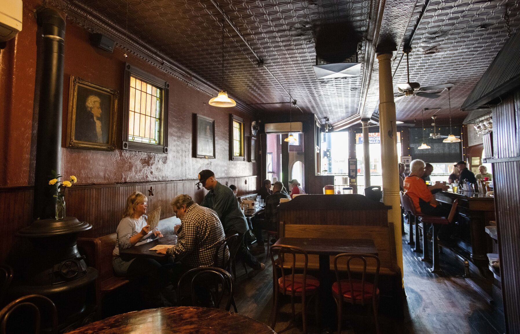 Customers begin to fill My Brother’s Bar Thursday, Oct. 6, 2022, before a Broncos Thursday Night Football game in Denver. The interior of Denver’s oldest bar hasn’t changed much since it opened in 1873. (The Gazette, Christian Murdock) (Christian Murdock/The Gazette)