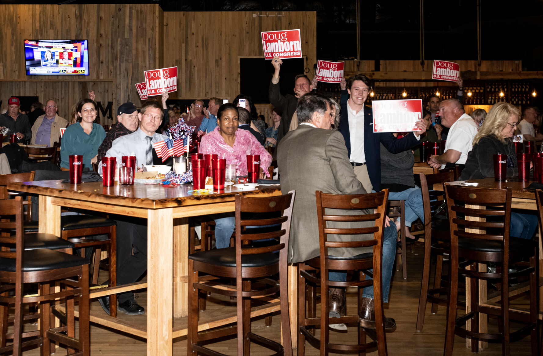 Supporters of Congressman Dough Lamborn hold signs as he give s speech at the El Paso Republican’s election watch party at Boot Barn Hall at Bourbon Brothers on Nov. 8, 2022. (The Gazette, Parker Seibold) (Parker Seibold)