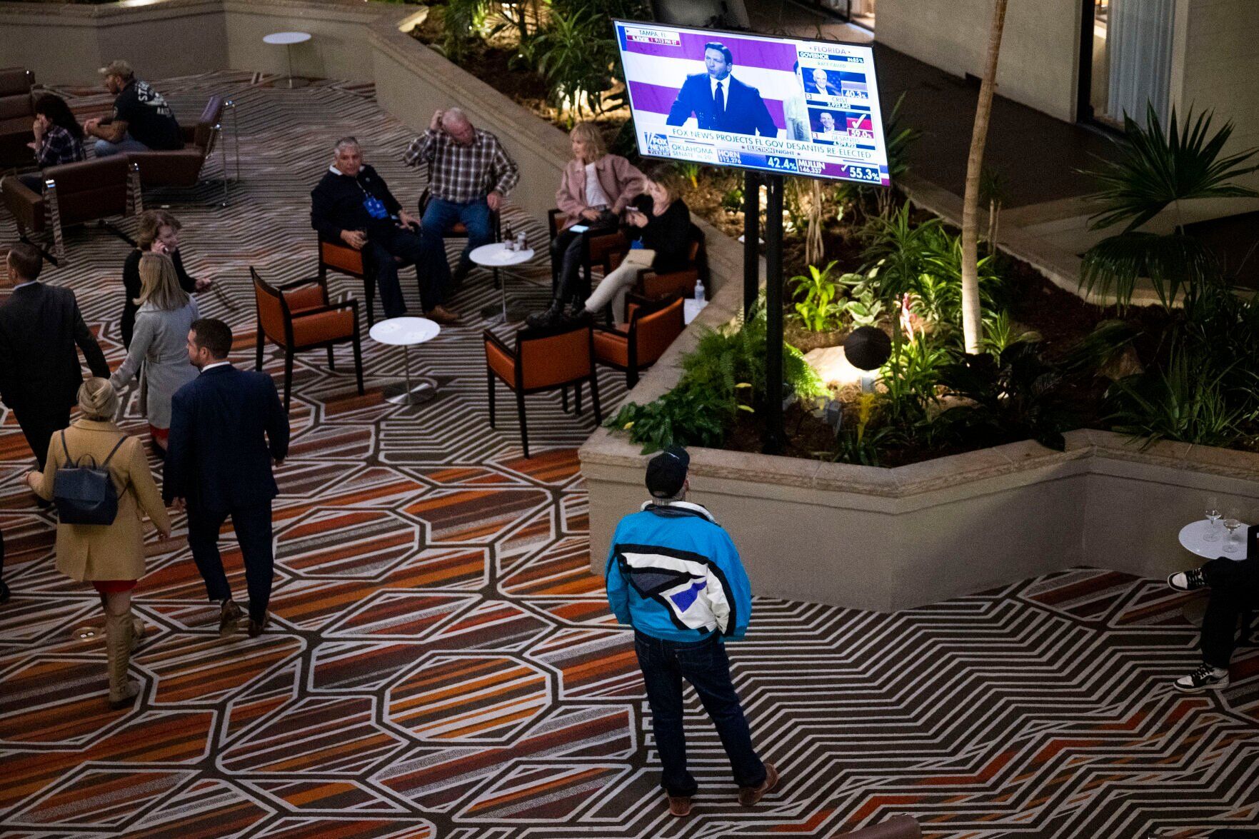 Domenic Rea tunes into live results in the lobby outside the bar during the Colorado GOP Election Night Party on Tuesday, Nov. 8, 2022, at the DoubleTree by Hilton DTC in Greenwood Village, Colo. (Timothy Hurst/The Gazette) (TIMOTHY HURST/DENVER GAZETTE)