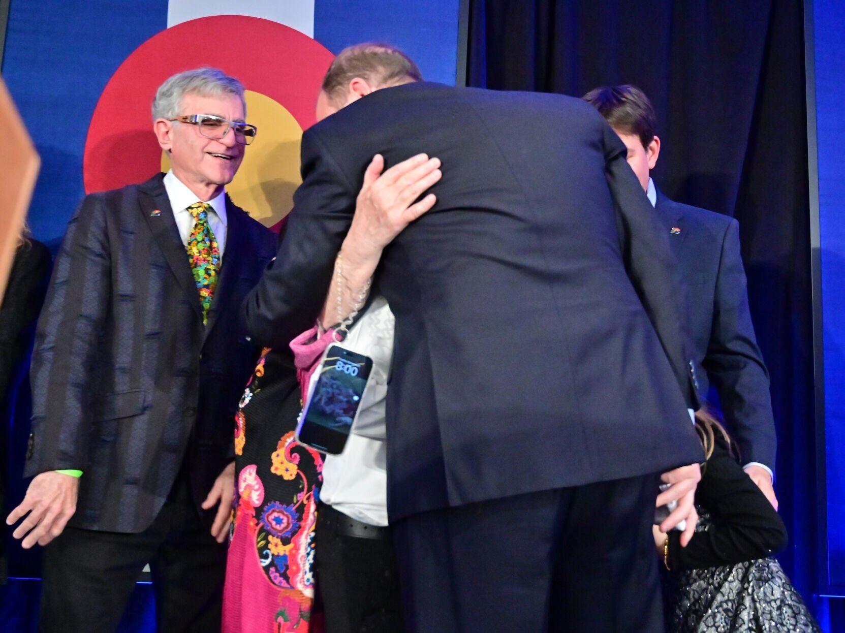 Col. Gov. Jared Polis recognizes and thanks his family after giving his victory speech at the Art Hotel in Denver, including his children, Cora and Caspian, his parents, Susan Polis Schutz and Stephen Schutz, and husband, Marlon Reis. He was elected to his second term and was speaking after winning the election. (Photo by Jerilee Bennett, The Gazette)