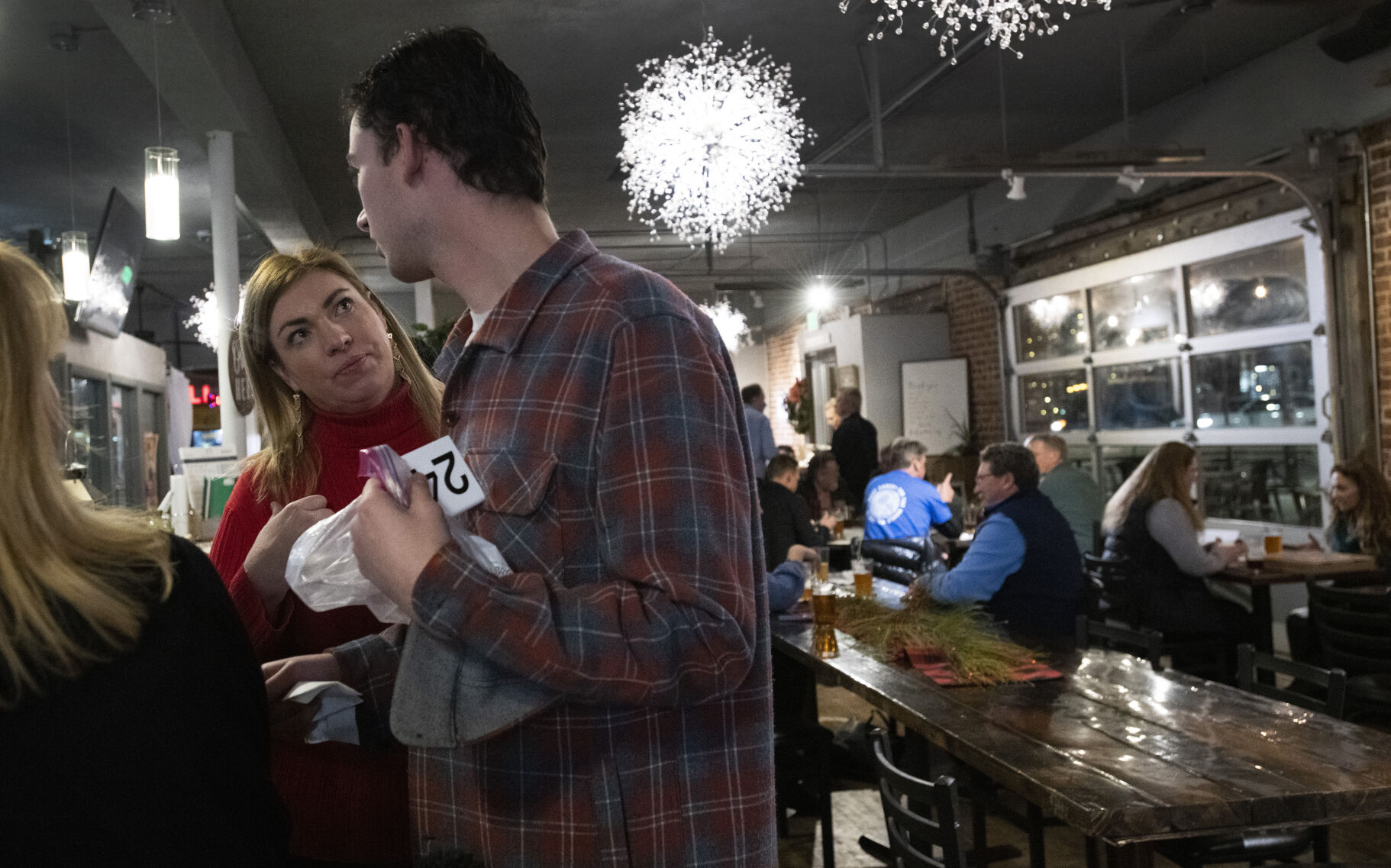 Owner Tiffany Fixter instructs Michael Newland on his next task Wednesday during the night shift at Brewability. (Christian Murdock,The Gazette)