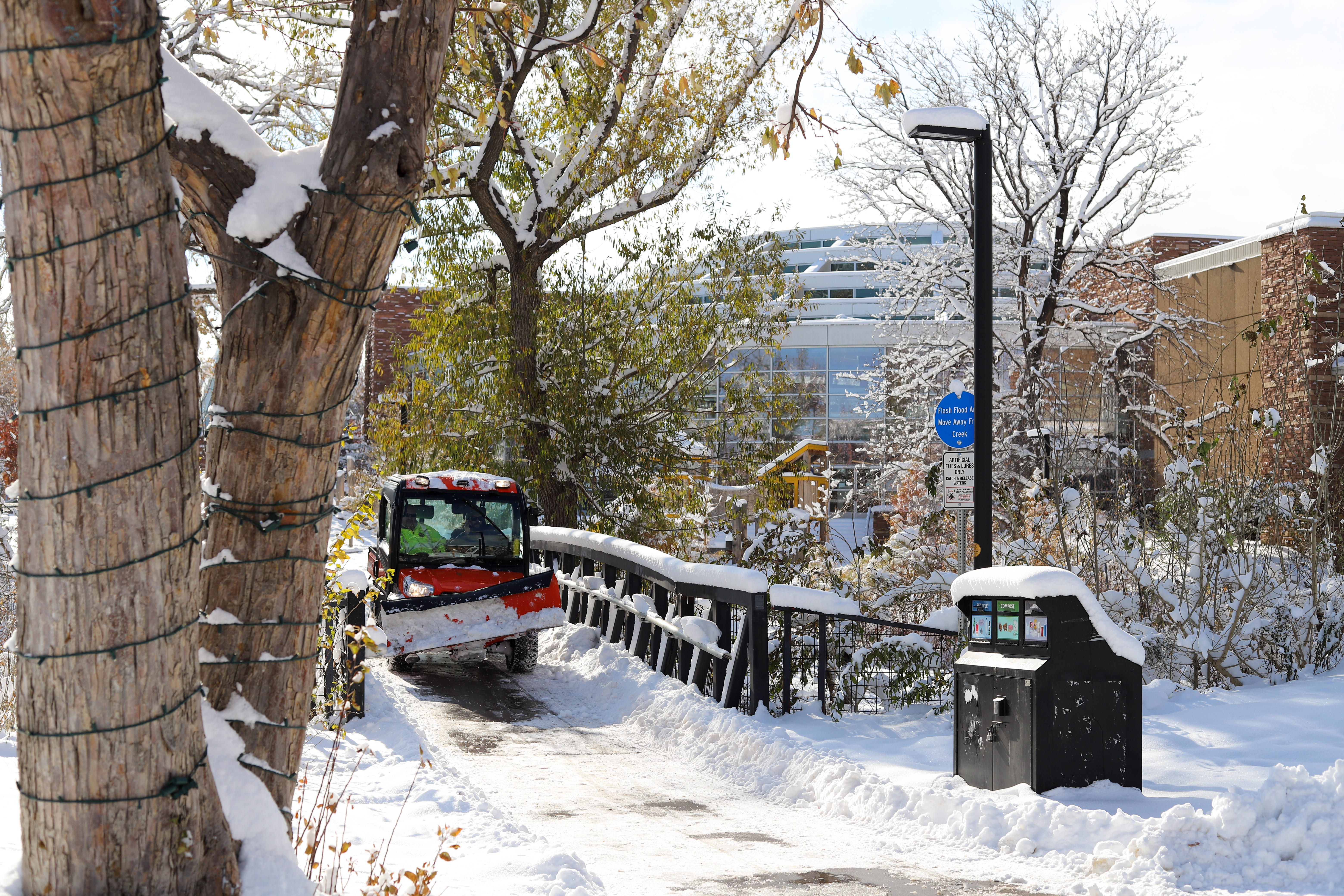 A snowplow drives through a Boulder park after Thursday's winter storm. (Kyla Pearce)