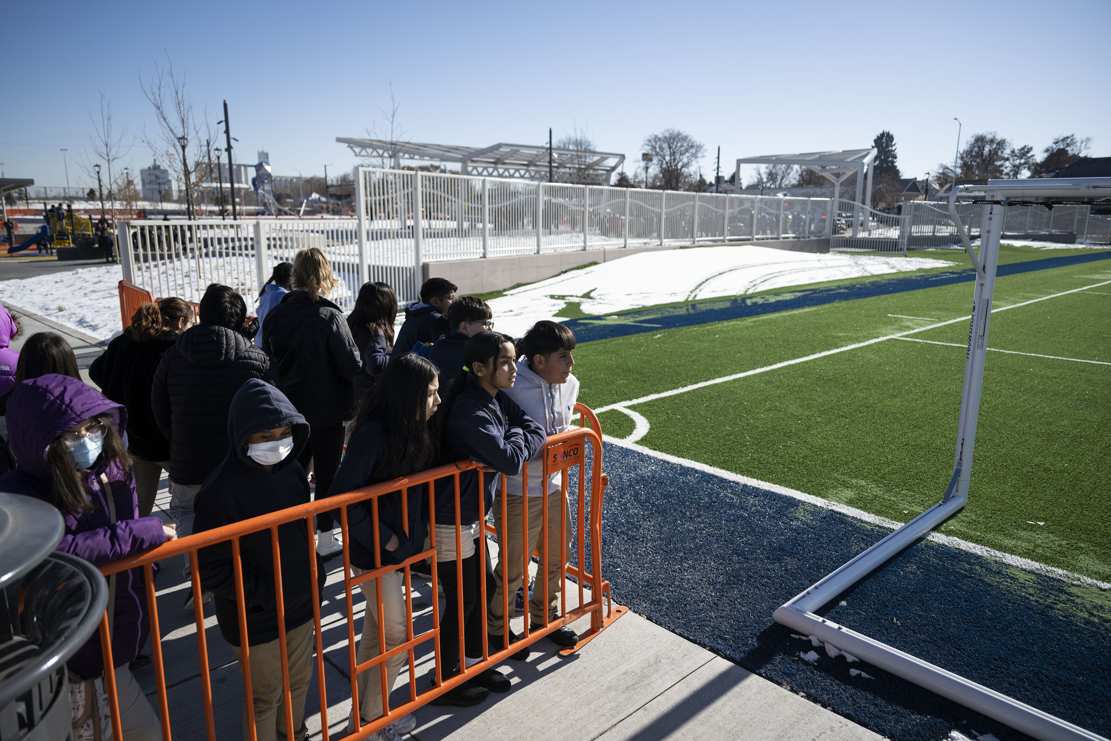 Swansea Elementary School fifth graders look out to the new soccer field on their way to check out a new playground after a ribbon-cutting event to celebrate the opening of the 4-acre Cover Park over Interstate 70 between Brighton Boulevard and Colorado Boulevard on Wednesday, Nov. 30, 2022, in Denver, Colo. (Timothy Hurst/The Gazette) (TimHursttim.hurst@gazette.comhttps://secure.gravatar.com/avatar/aca82bd62b4ee425c598527cd6faa1b1?d=mm&r=g)