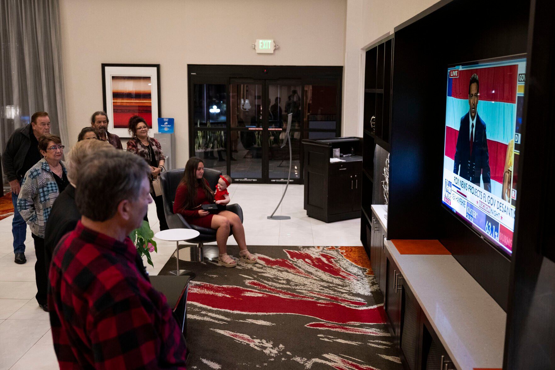 People watch as Florida Gov. Ron DeSantis gives a speech during the Colorado GOP Election Night Party on Tuesday, Nov. 8, 2022, at the DoubleTree by Hilton DTC in Greenwood Village, Colo. (Timothy Hurst/The Gazette) (TIMOTHY HURST/DENVER GAZETTE)