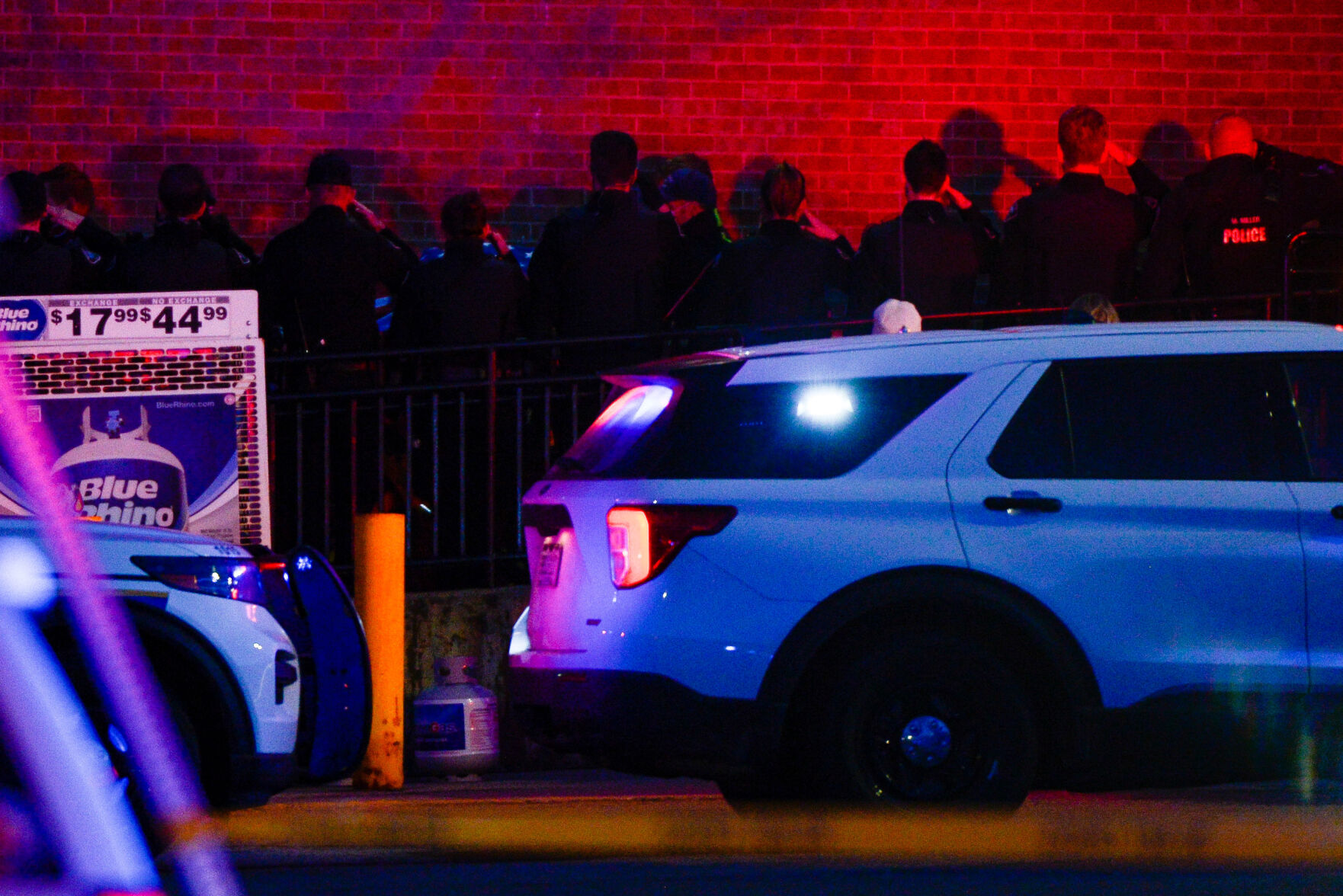 Police officers salute as emergency responders move the body of slain Boulder Police officer Eric Talley from the scene of a shooting at a King Soopers on Monday, March 22, 2021 in Boulder. Ten people were killed in the shooting. (Michael Ciaglo/Special to The Denver Gazette) (Michael Ciaglo/Special to The De)