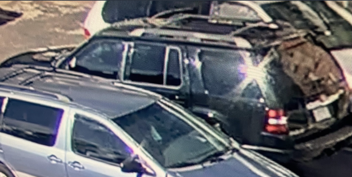 Denver Police are looking for the black SUV pictured here in connection with an East Colfax Avenue area shooting that killed one and sent four to the hospital. Anyone with information is asked to call police via CrimeStoppers at 720-913-7867. (COURTESY OF THE DENVER POLICE DEPARTMENT)