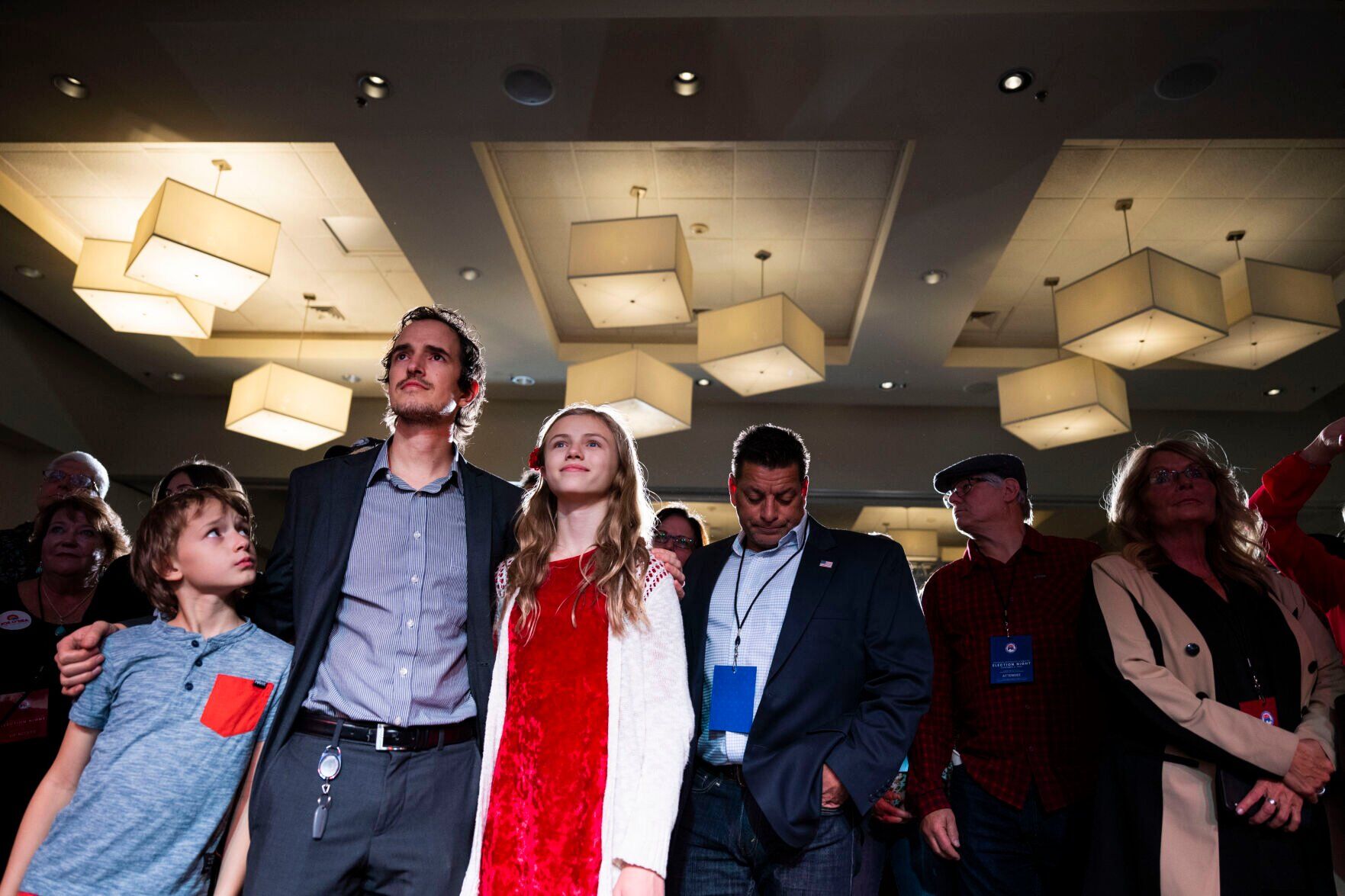 FGather David Brown holds his children Ryker, 9, and Arena, 12, while they and others wait for Colorado Republican U.S. Senate candidate Joe O’Dea to come to the main stage during the Colorado GOP Election Night Party on Tuesday, Nov. 8, 2022, at the DoubleTree by Hilton DTC in Greenwood Village, Colo. (Timothy Hurst/The Gazette) (TIMOTHY HURST/DENVER GAZETTE)