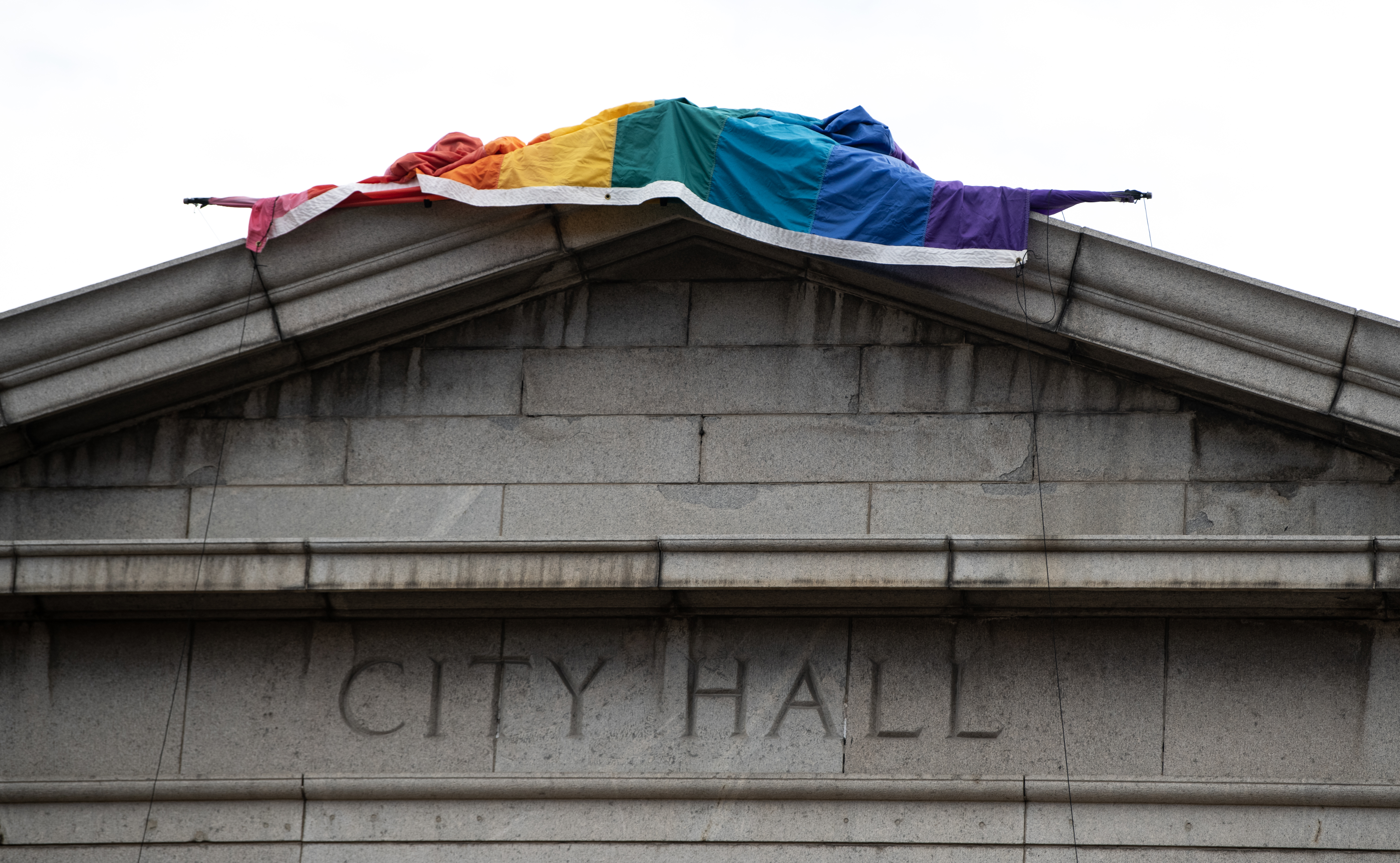 The ‘Sacred Cloth’ pride flag sits on top of Colorado Springs City Hall before being fully displayed on Wednesday, Nov. 23, 2022. (The Gazette, Parker Seibold) (Parker Seibold)
