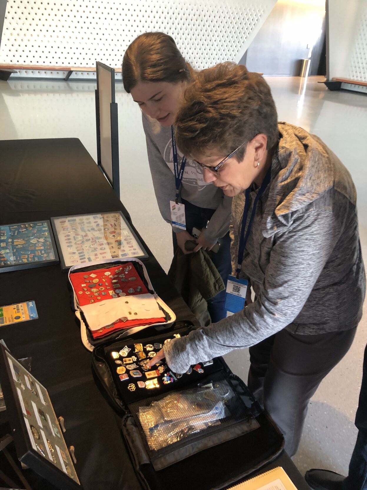 Attendees browse displays of Olympic lapel pins and memorabilia at the 2021 Olympin Club Festival in Atlanta. (Courtesy photo)