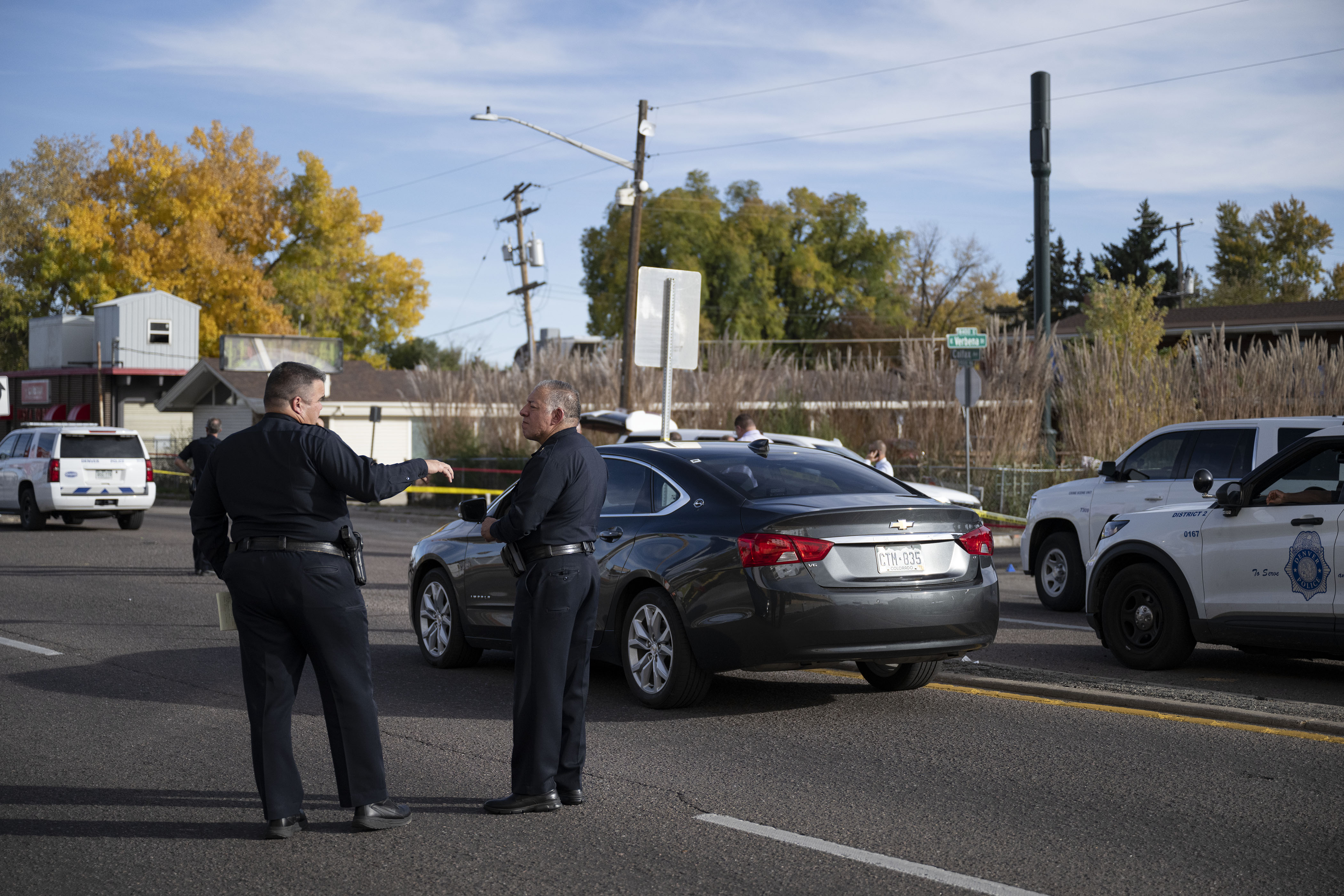 Denver Police Department Commander Matt Clark, left, speaks with another department employee at the scene of a midday shooting on the 1400 block of Verbena Street, just south of East Colfax Avenue on Tuesday, Nov. 1, 2022, in Denver, Colo. A total of six people were shot on the east side of Michael Convenience Store, with one dying, and three in critical condition as of 5 p.m. (Timothy Hurst/The Gazette) (TimHursttim.hurst@gazette.comhttps://secure.gravatar.com/avatar/aca82bd62b4ee425c598527cd6faa1b1?d=mm&r=g)