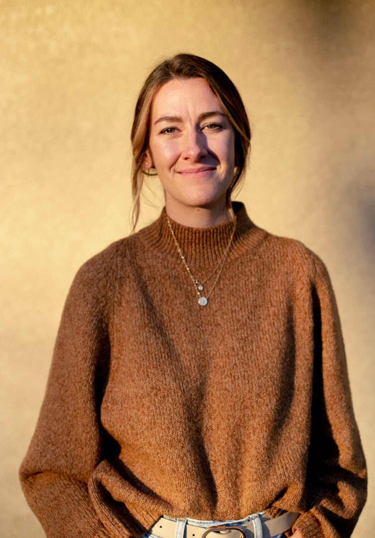 Colleen Froehlich poses for a portrait outside her office Nov. 16. (Parker Seibold, The Gazette)