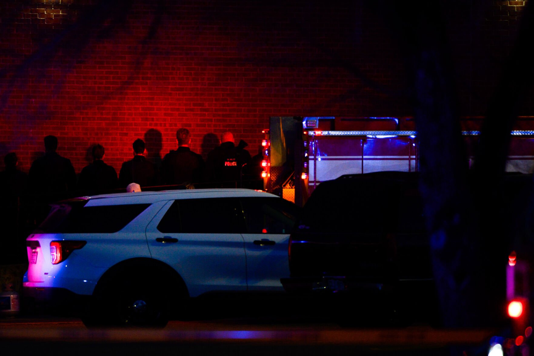 Police officers stand at attention as emergency responders prepare to move the body of slain Boulder Police officer Eric Talley from the scene of a shooting at a King Soopers on Monday, March 22, 2021 in Boulder. Ten people were killed in the shooting. (Michael Ciaglo/Special to The Denver Gazette) (Michael Ciaglo/Special to The De)