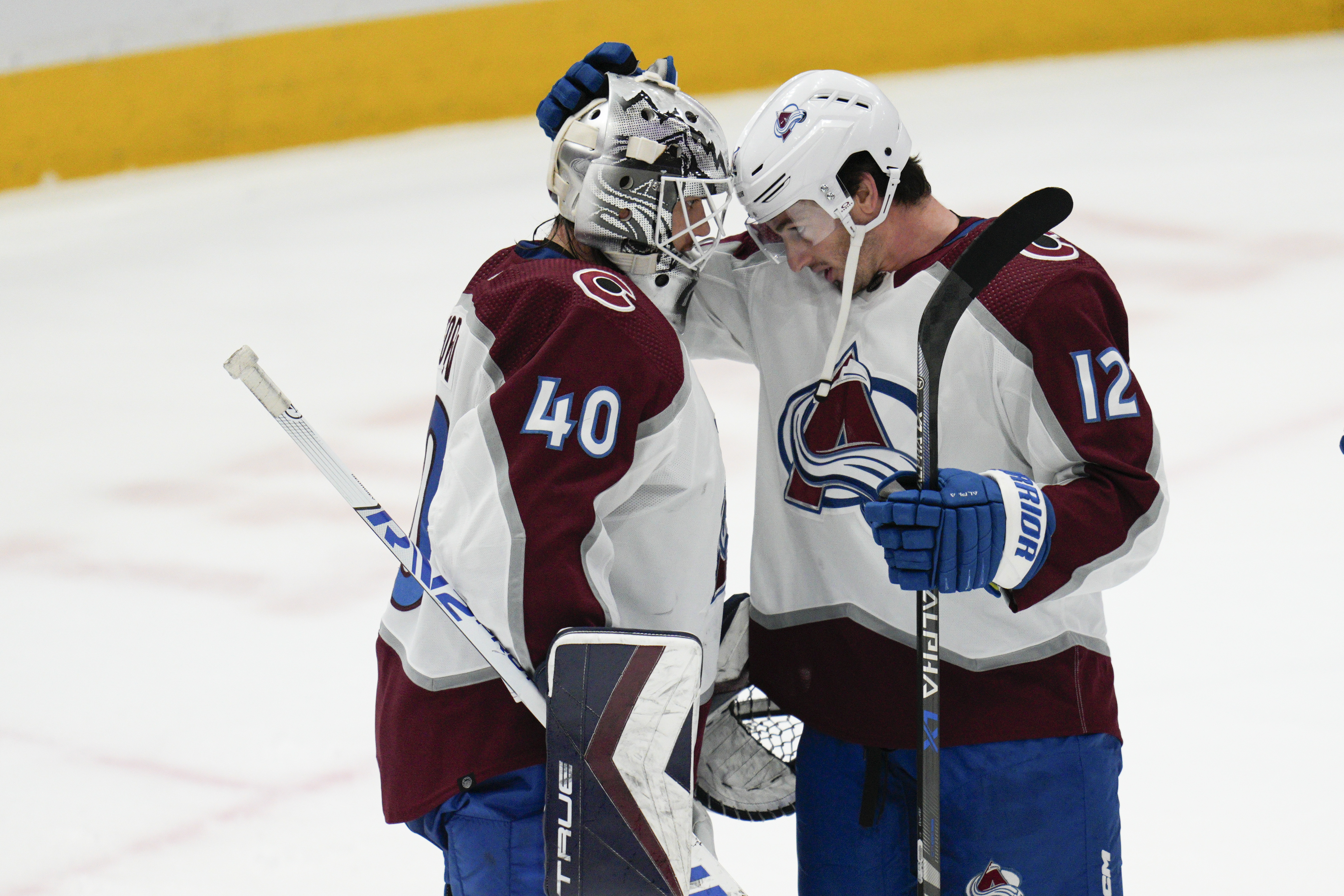 Colorado Avalanche center Jayson Megna (12) hugs goaltender Alexandar Georgiev (40) after an NHL hockey game against the Washington Capitals, Saturday, Nov. 19, 2022, in Washington. (AP Photo/Jess Rapfogel) (Jess Rapfogel)