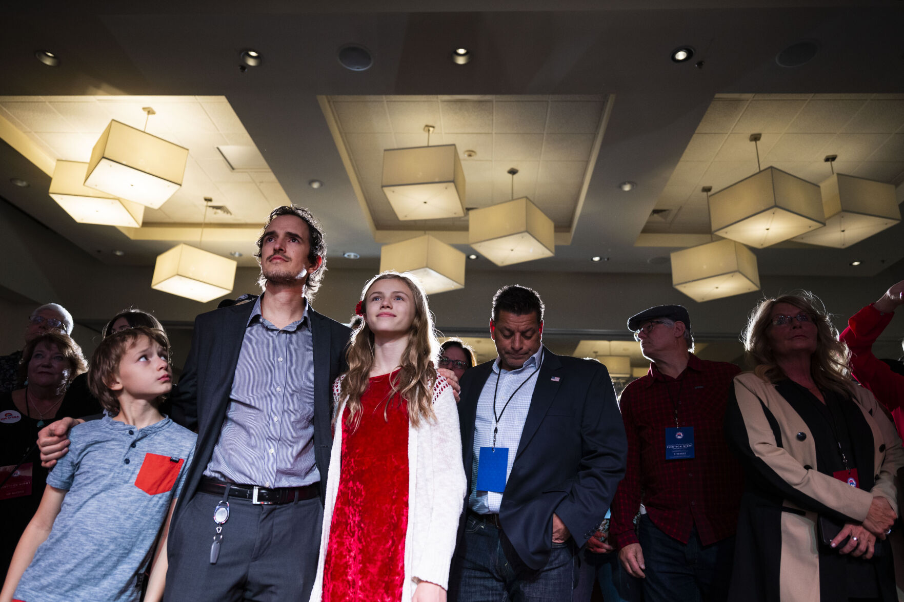 FGather David Brown holds his children Ryker, 9, and Arena, 12, while they and others wait for Colorado Republican U.S. Senate candidate Joe O’Dea to come to the main stage during the Colorado GOP Election Night Party on Tuesday, Nov. 8, 2022, at the DoubleTree by Hilton DTC in Greenwood Village, Colo. (Timothy Hurst/The Gazette) (TIMOTHY HURST/DENVER GAZETTE)