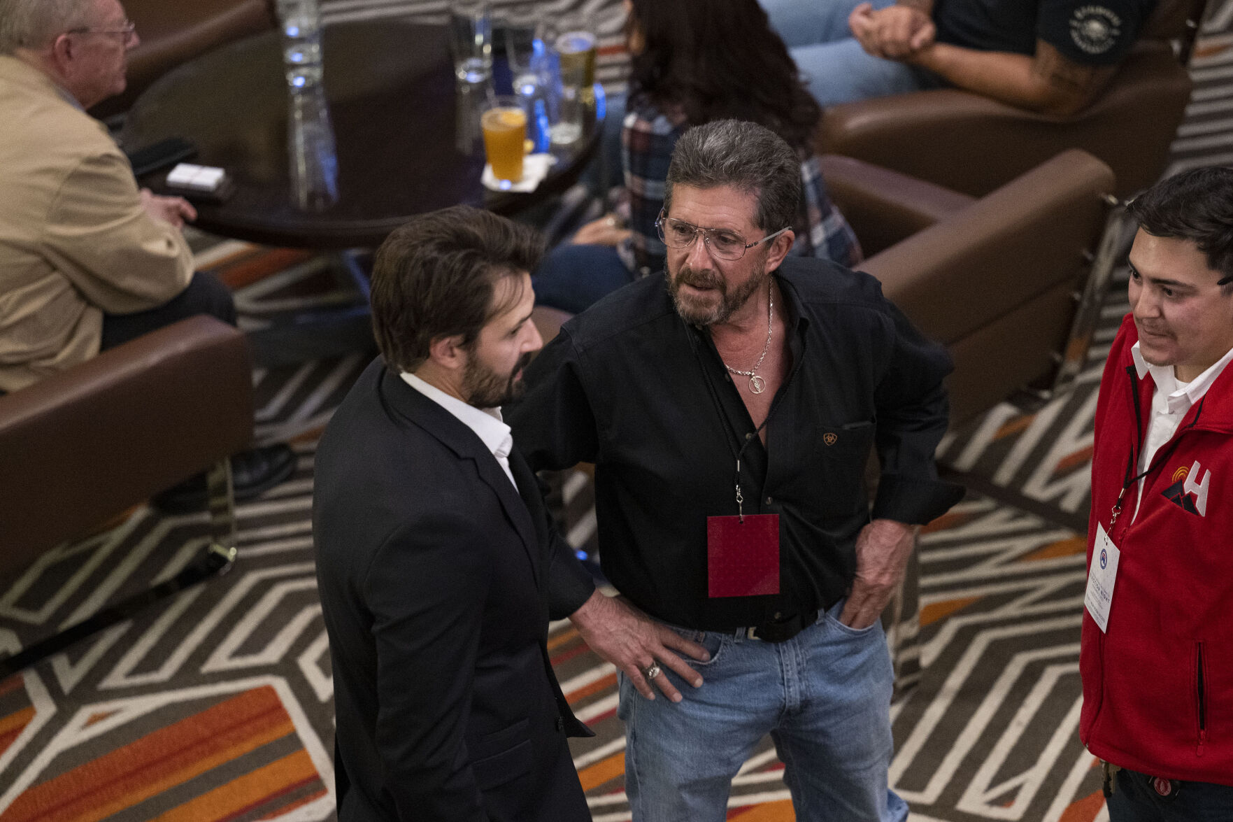 Steve Wells, center, visits with others by the bar in the lobby during the Colorado GOP Election Night Party on Tuesday, Nov. 8, 2022, at the DoubleTree by Hilton DTC in Greenwood Village, Colo. (Timothy Hurst/The Gazette) (TIMOTHY HURST/DENVER GAZETTE)