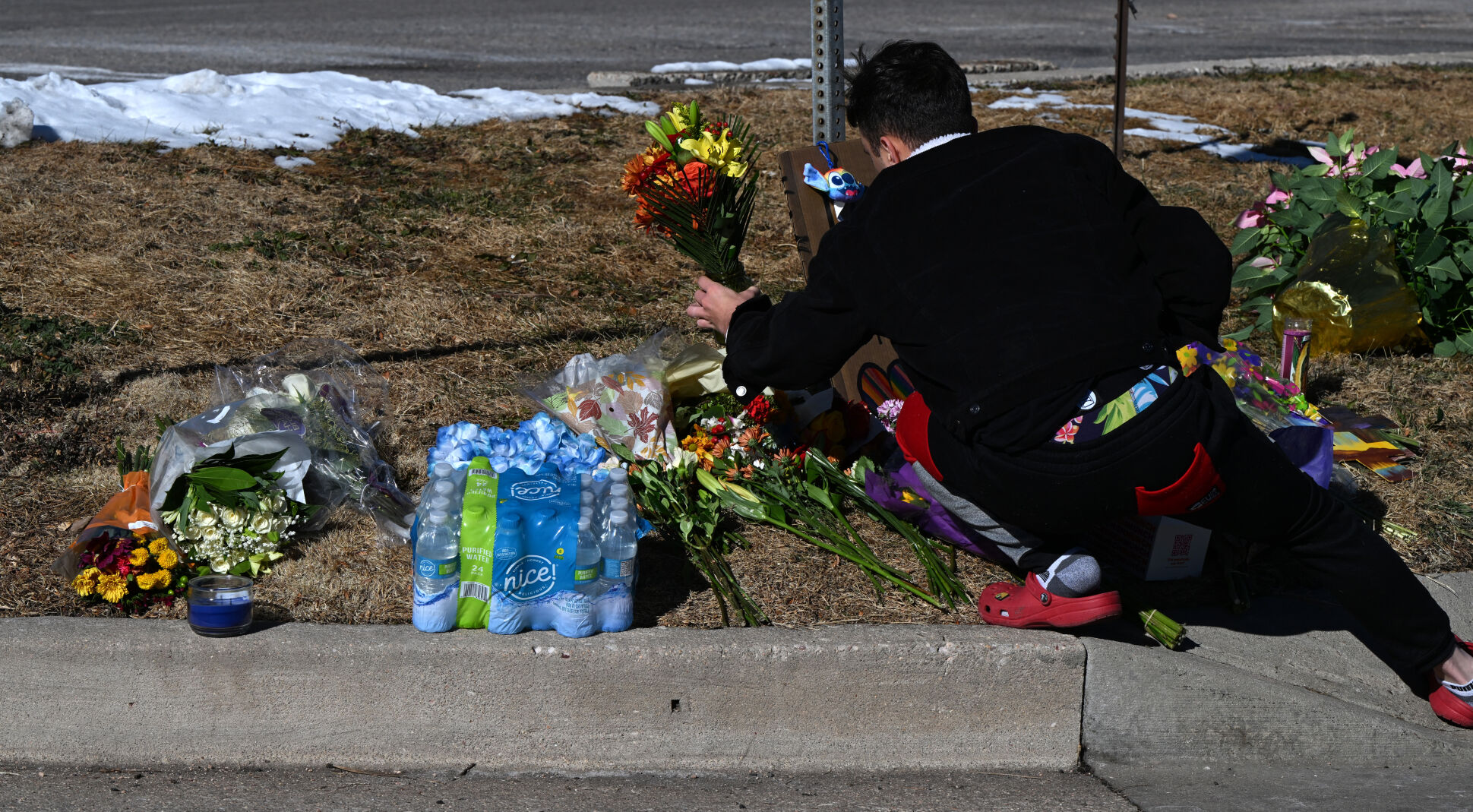 Tyrice Kelley, center, a performer at Club Q, is comforted during a Sunday service held at All Souls Unitarian Church for people to mourn following the mass shooting in Colorado Springs the night before. (Parker Seibold, The DENVER Gazette)