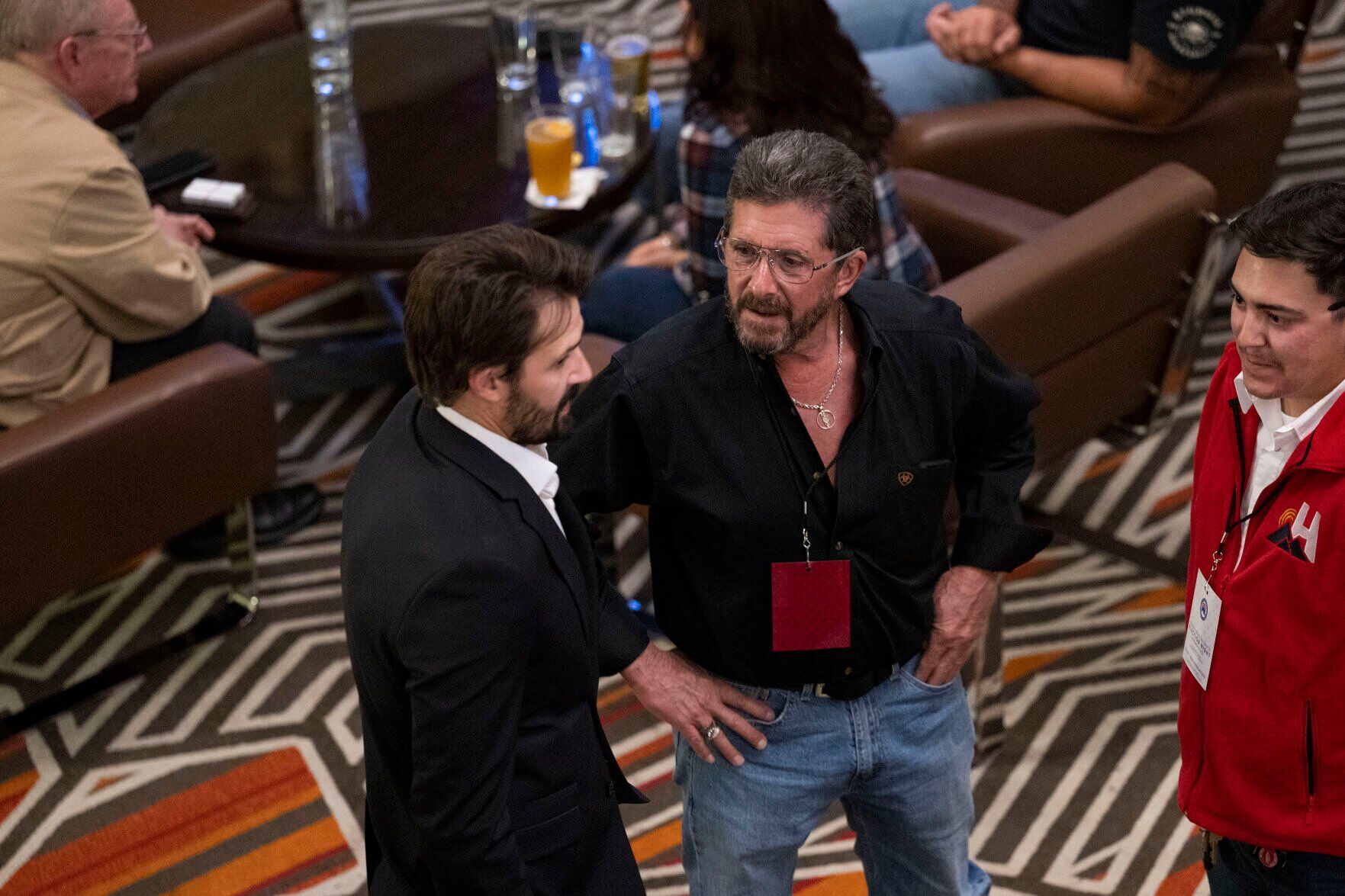 Steve Wells, center, visits with others by the bar in the lobby during the Colorado GOP Election Night Party on Tuesday, Nov. 8, 2022, at the DoubleTree by Hilton DTC in Greenwood Village, Colo. (Timothy Hurst/The Gazette) (TIMOTHY HURST/DENVER GAZETTE)