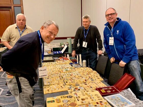 Attendees browse displays of Olympic lapel pins and memorabilia at the 2021 Olympin Club Festival in Atlanta. (Courtesy photo)