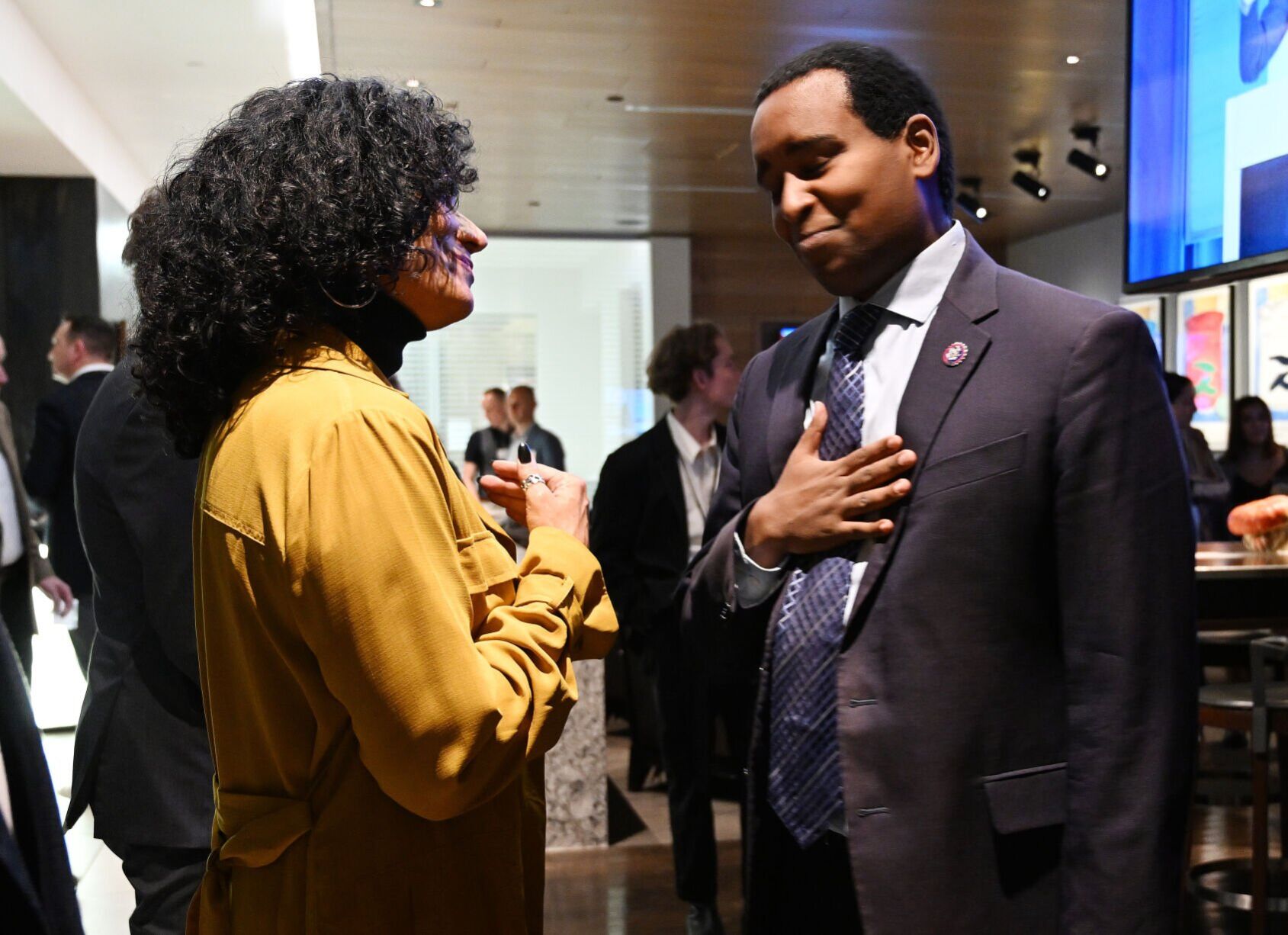 U.S. Rep. Joe Neguse congratulates the new CU Regent Wanda James before taking the stage to do his victory speech at the Art Hotel on election night, Nov. 8, 2022. (Photo by Jerilee Bennett, The Gazette)